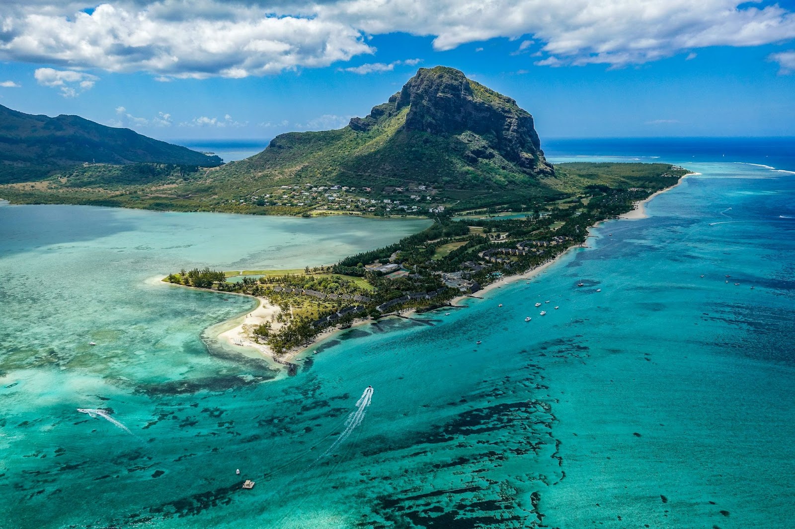Le Morne Brabant mountain with blue waters, coral reefs, and white sandy beaches in Mauritius.