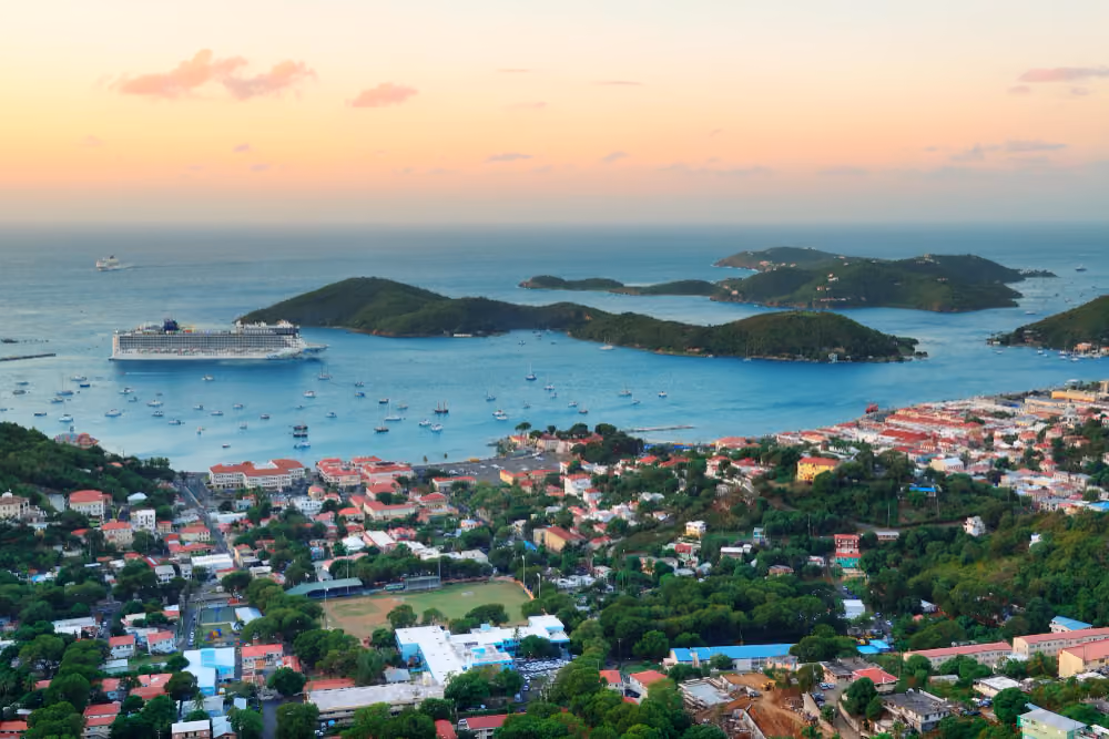 islands sunrise with colorful cloud, buildings and beach coast