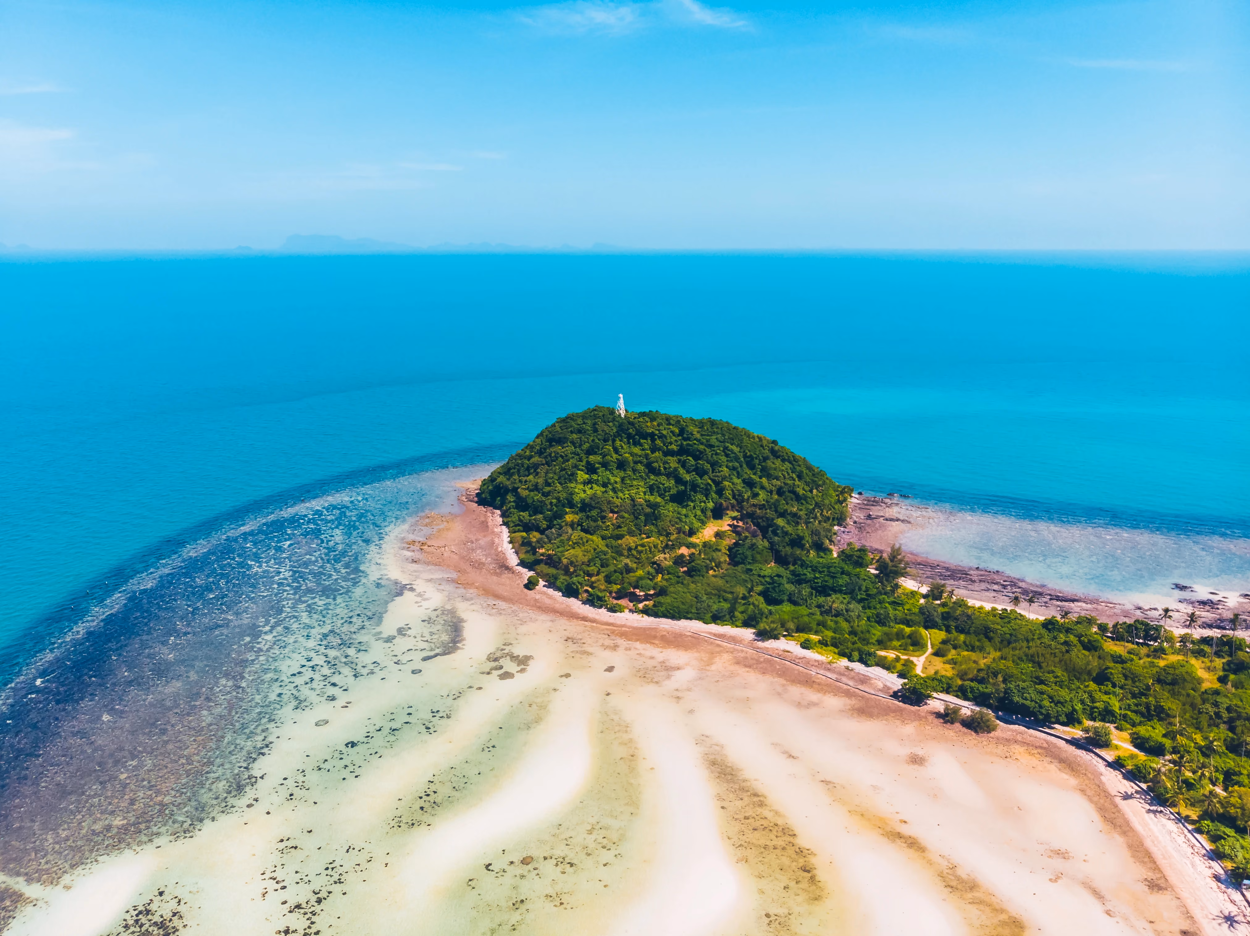 Le Morne Brabant mountain with blue waters, coral reefs, and white sandy beaches in Mauritius.