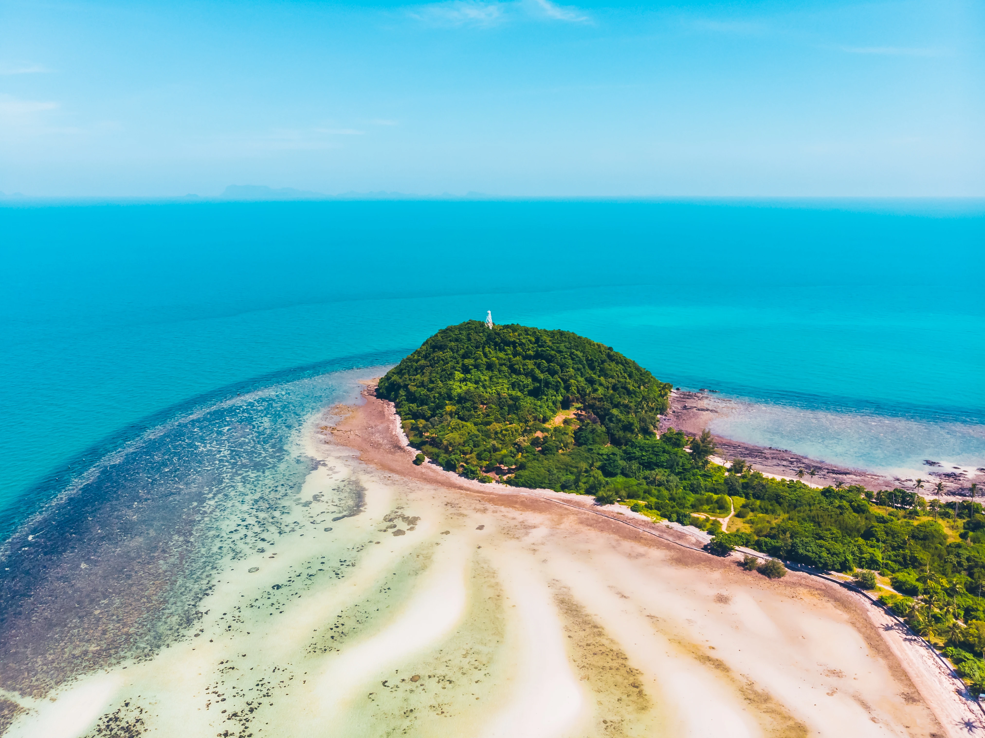 Le Morne Brabant mountain with blue waters, coral reefs, and white sandy beaches in Mauritius.