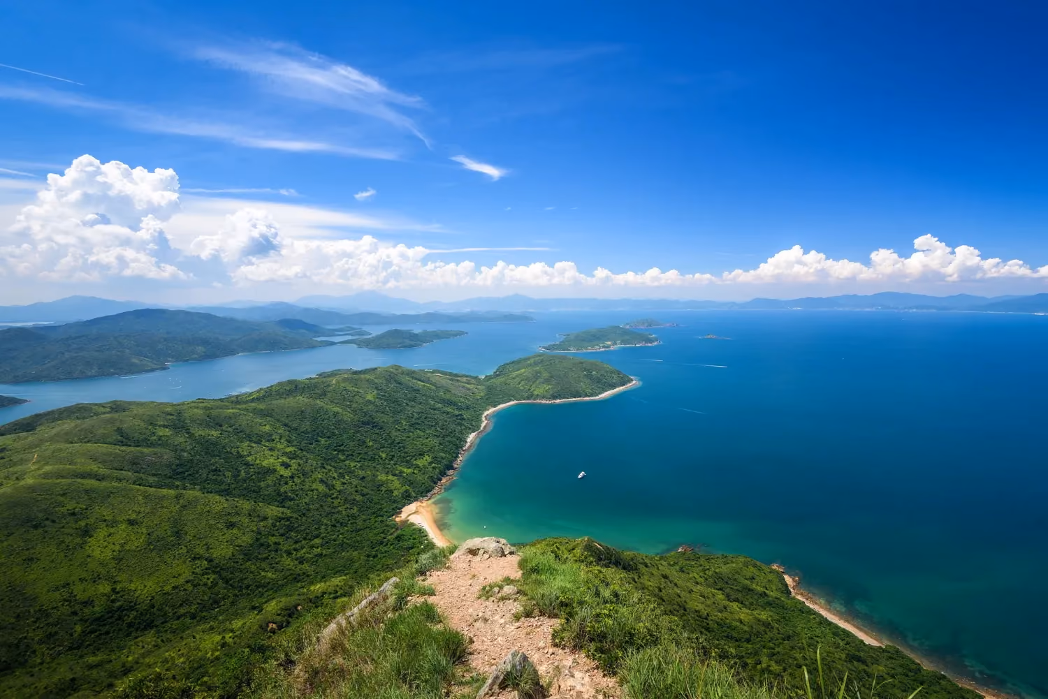Hong Island, Thailand, with clear blue lagoons and limestone cliffs.
