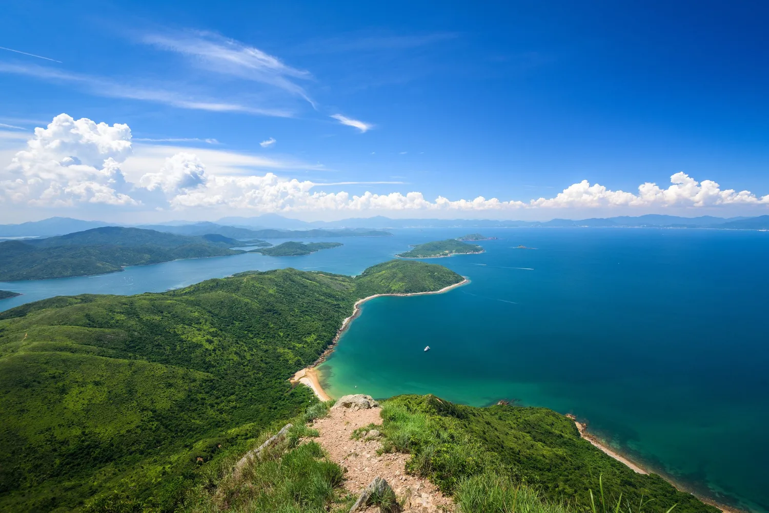 Hong Island, Thailand, with clear blue lagoons and limestone cliffs.