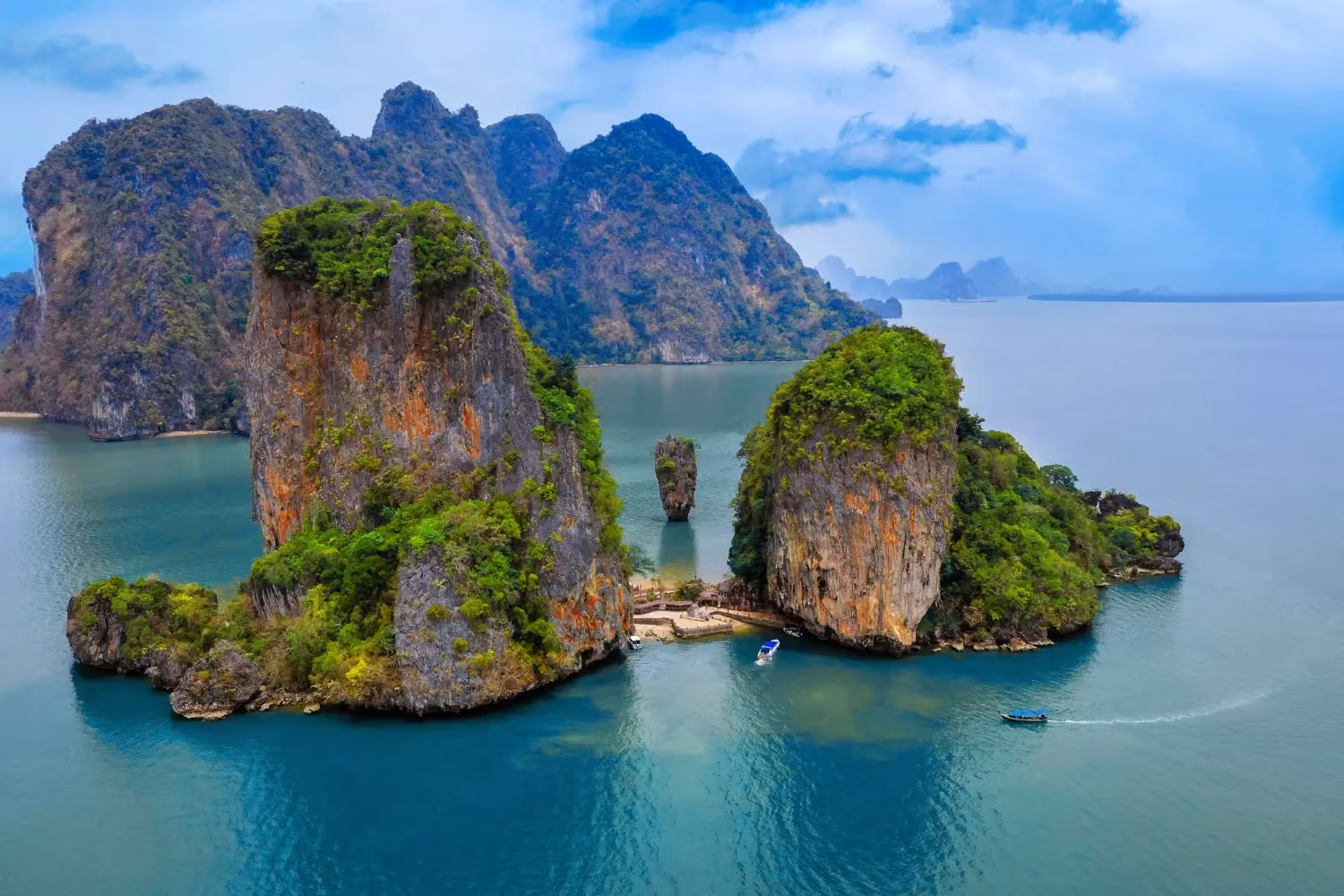 Koh Phangan, Thailand, a tropical island with sandy beaches, palm trees, and clear blue waters.