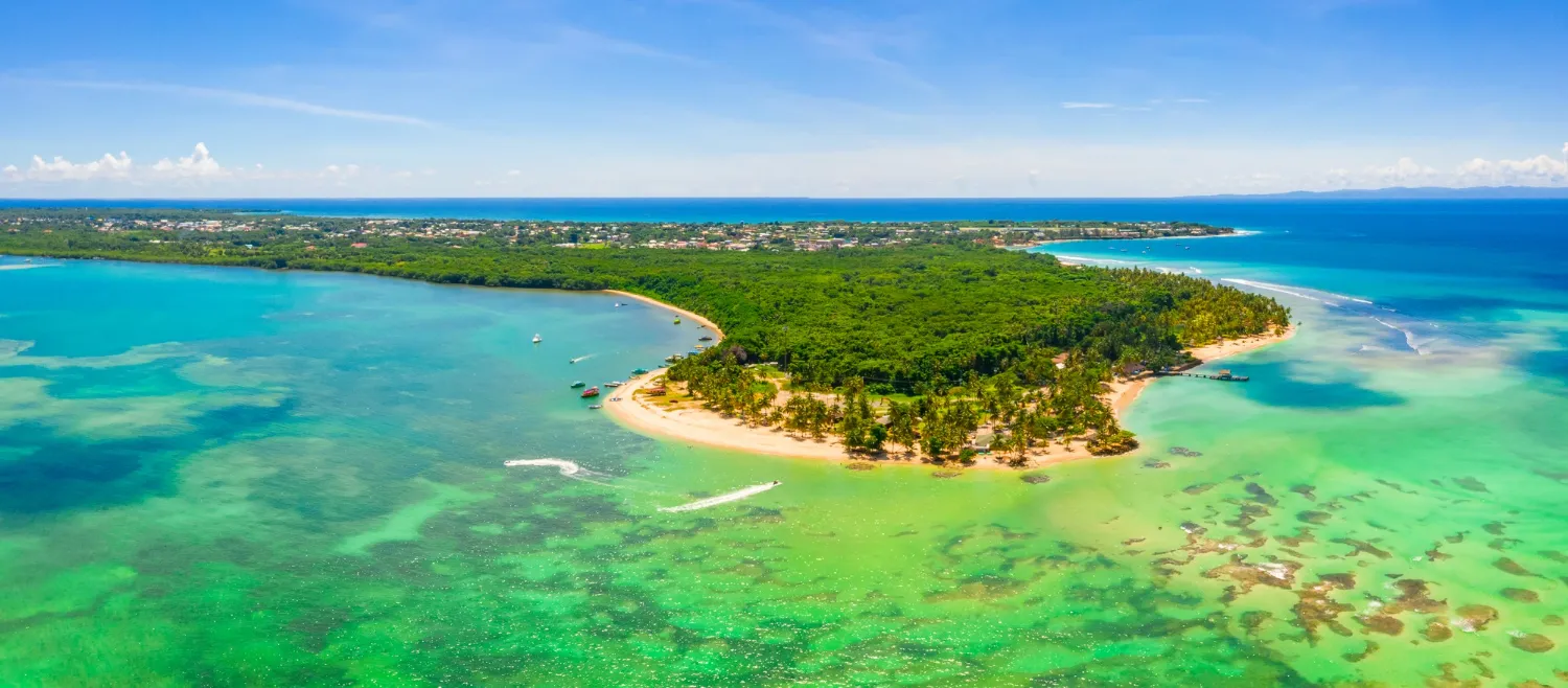 Le Morne Brabant mountain with blue waters, coral reefs, and white sandy beaches in Mauritius.
