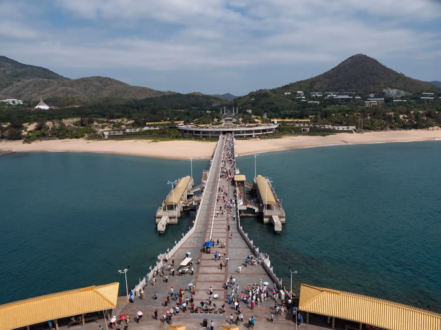 Gateway to Phuket’s island adventures—calm waters, scenic views, and long-tail boats at Ao Po Pier.