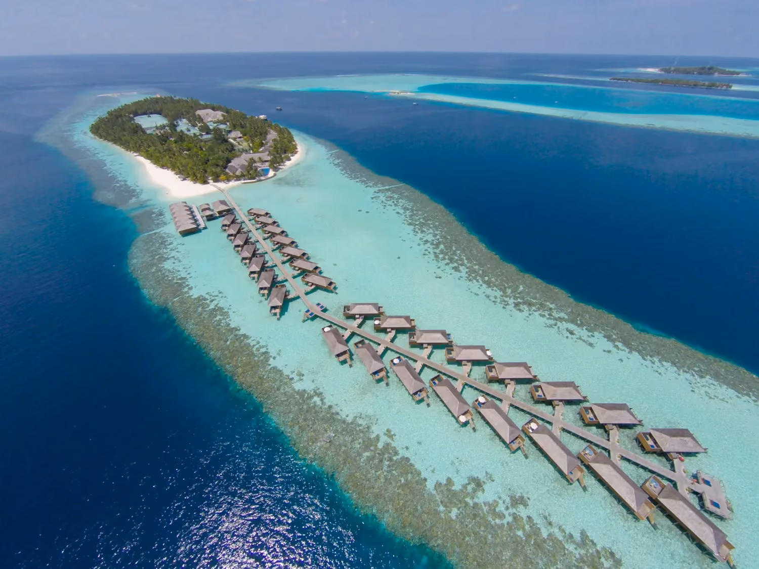 Crystal-clear lagoons, overwater villas, and quiet sunsets create the ultimate short luxury getaway for couples.