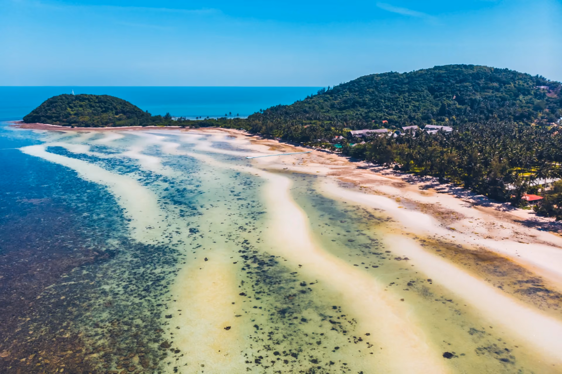 white sandbanks, shallow coral reefs, and lush green hills — a secluded and uncrowded alternative for couples comparing Cambodia vs Sri Lanka for a private getaway.
