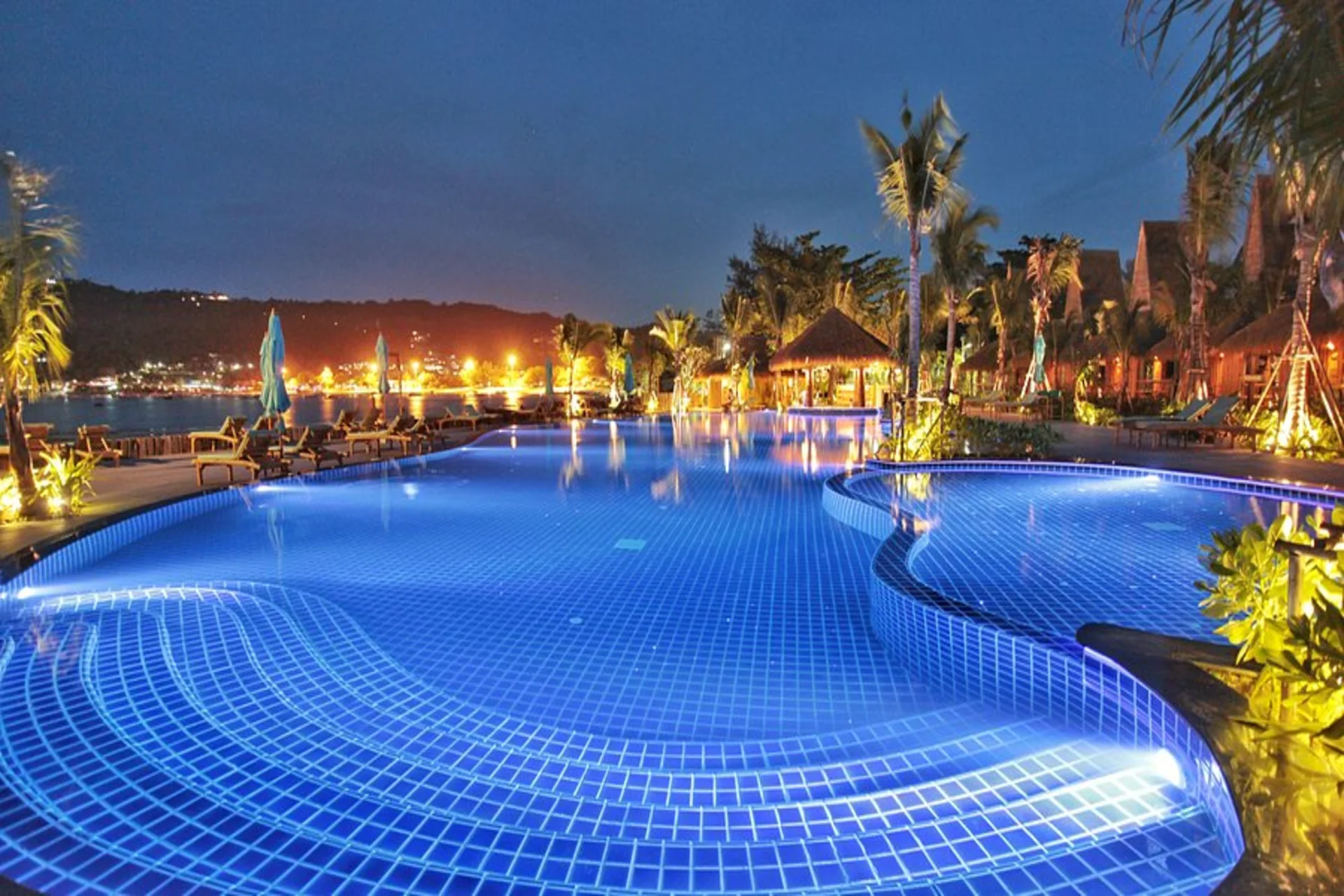 Colourful bungalows, tropical vibes, and sea views — CoCo Beach Resort is pure island fun.