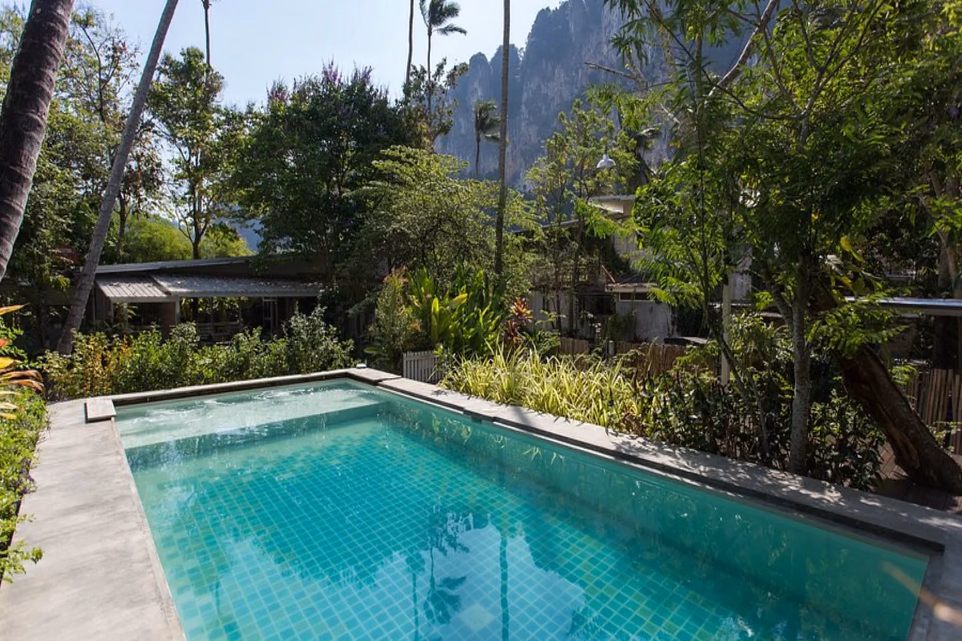 Glur Hostel offers calm vibes, green surroundings, and a pool—perfect for backpackers who love peace and comfort