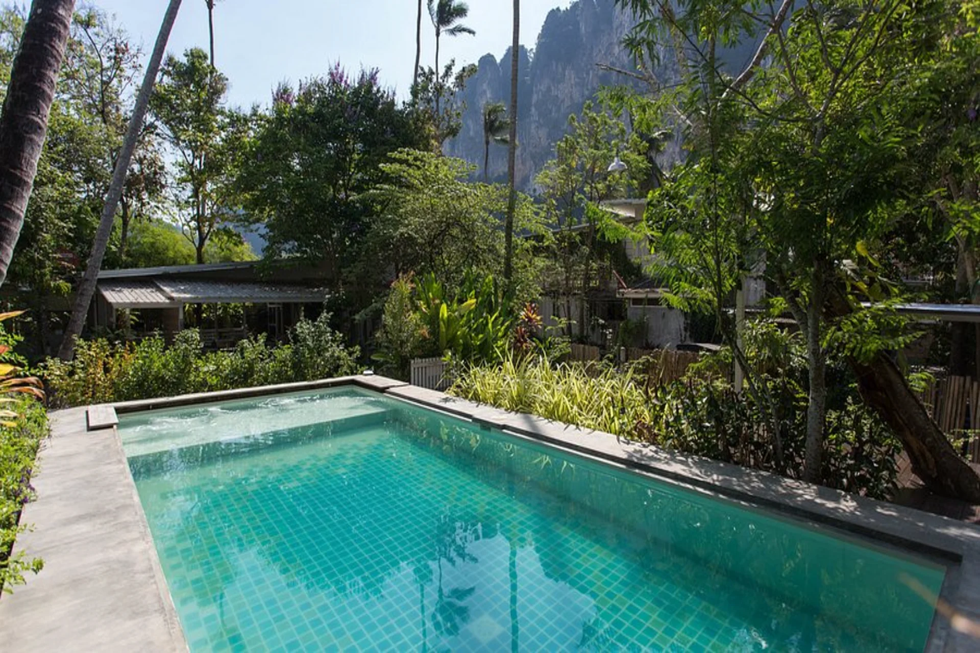 Glur Hostel offers calm vibes, green surroundings, and a pool—perfect for backpackers who love peace and comfort
