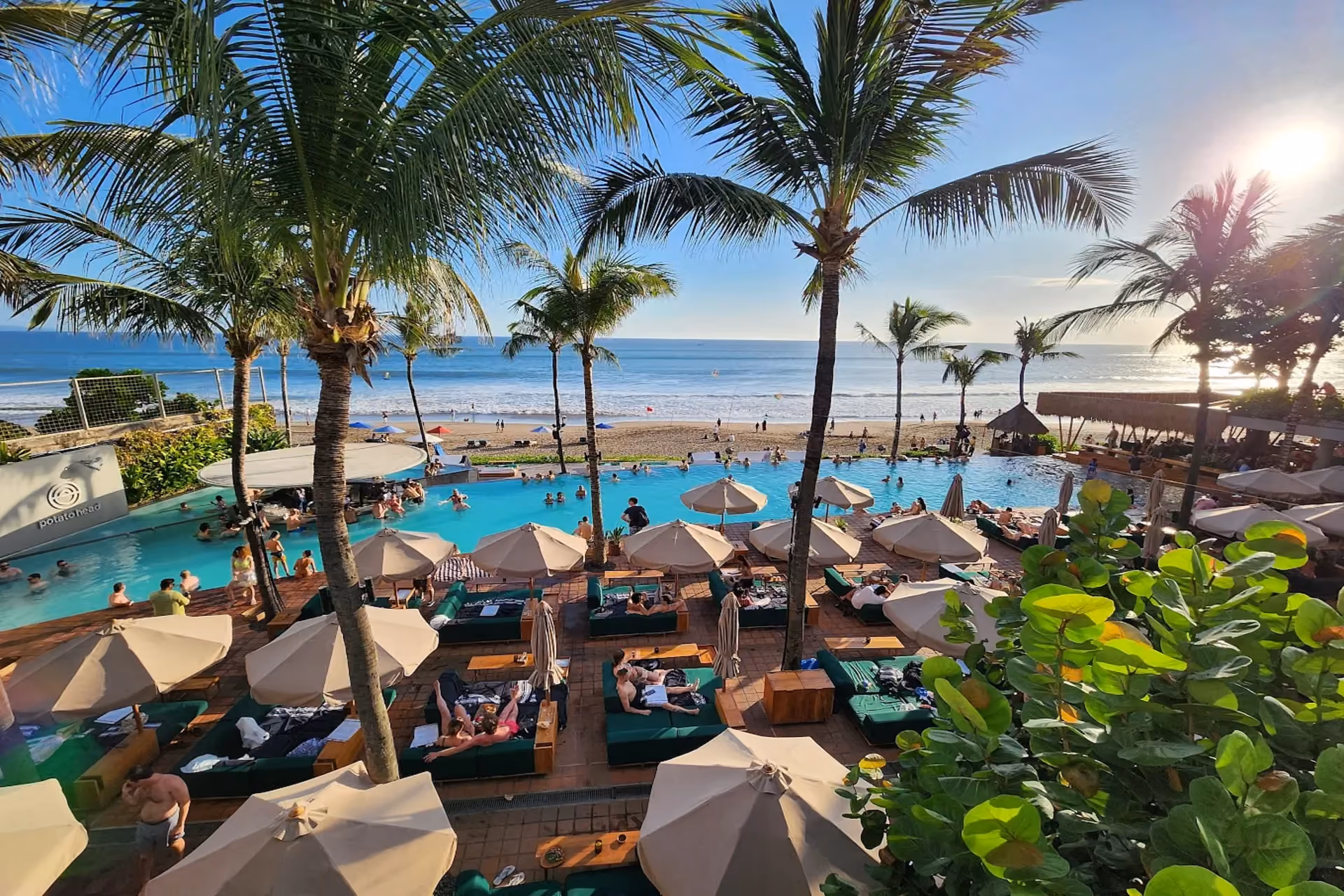 Poolside vibes and sunset parties at Potato Head Beach Club.