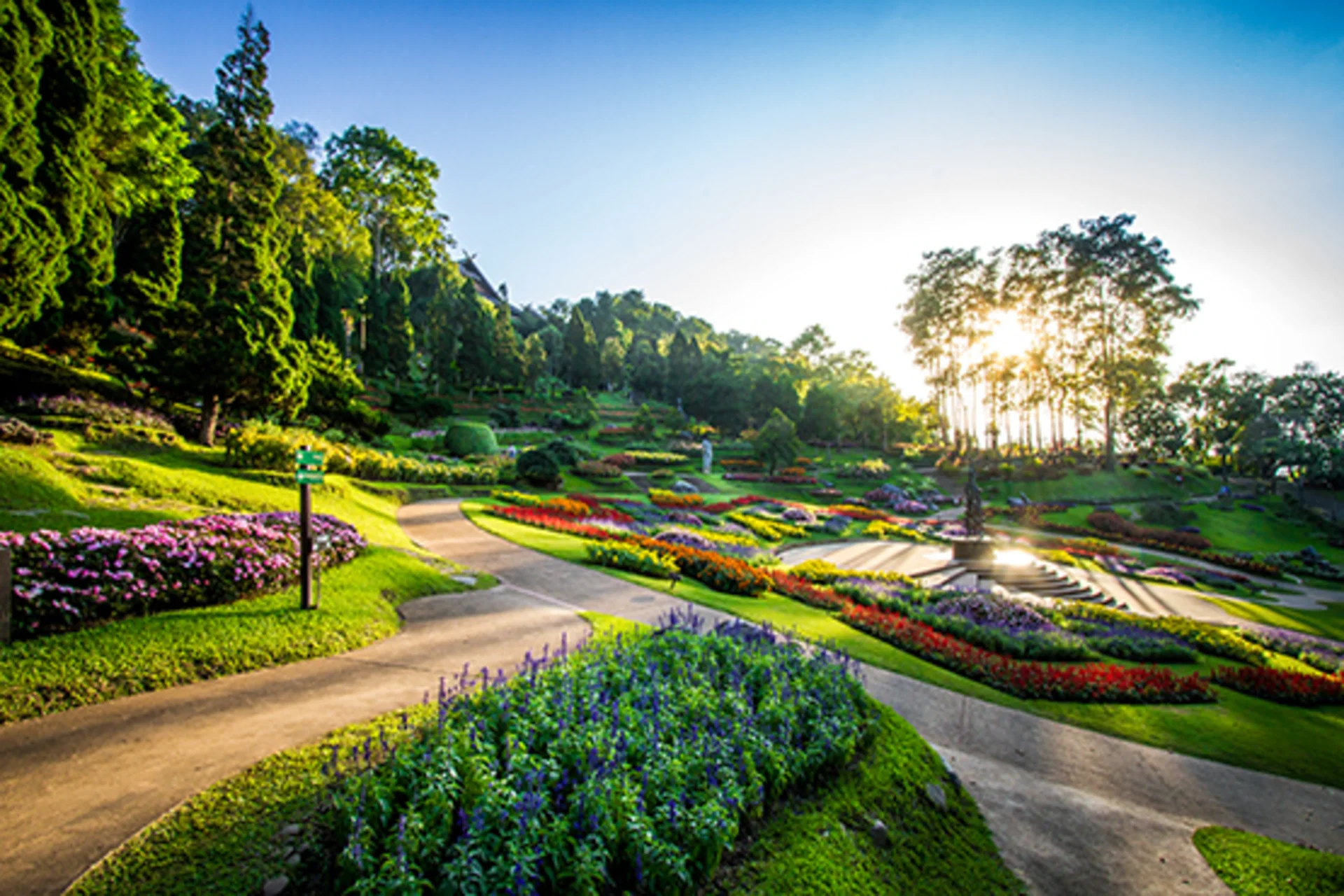Beautiful mountain gardens filled with flowers, artworks, and cool weather views.
