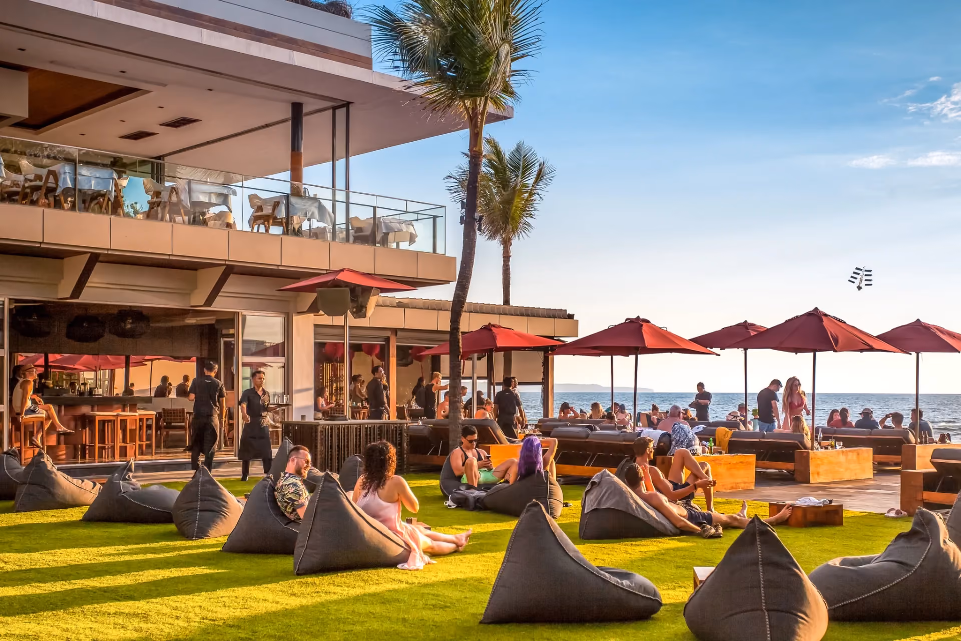 Sunset cocktails and beachfront views at the iconic Ku De Ta Seminyak.