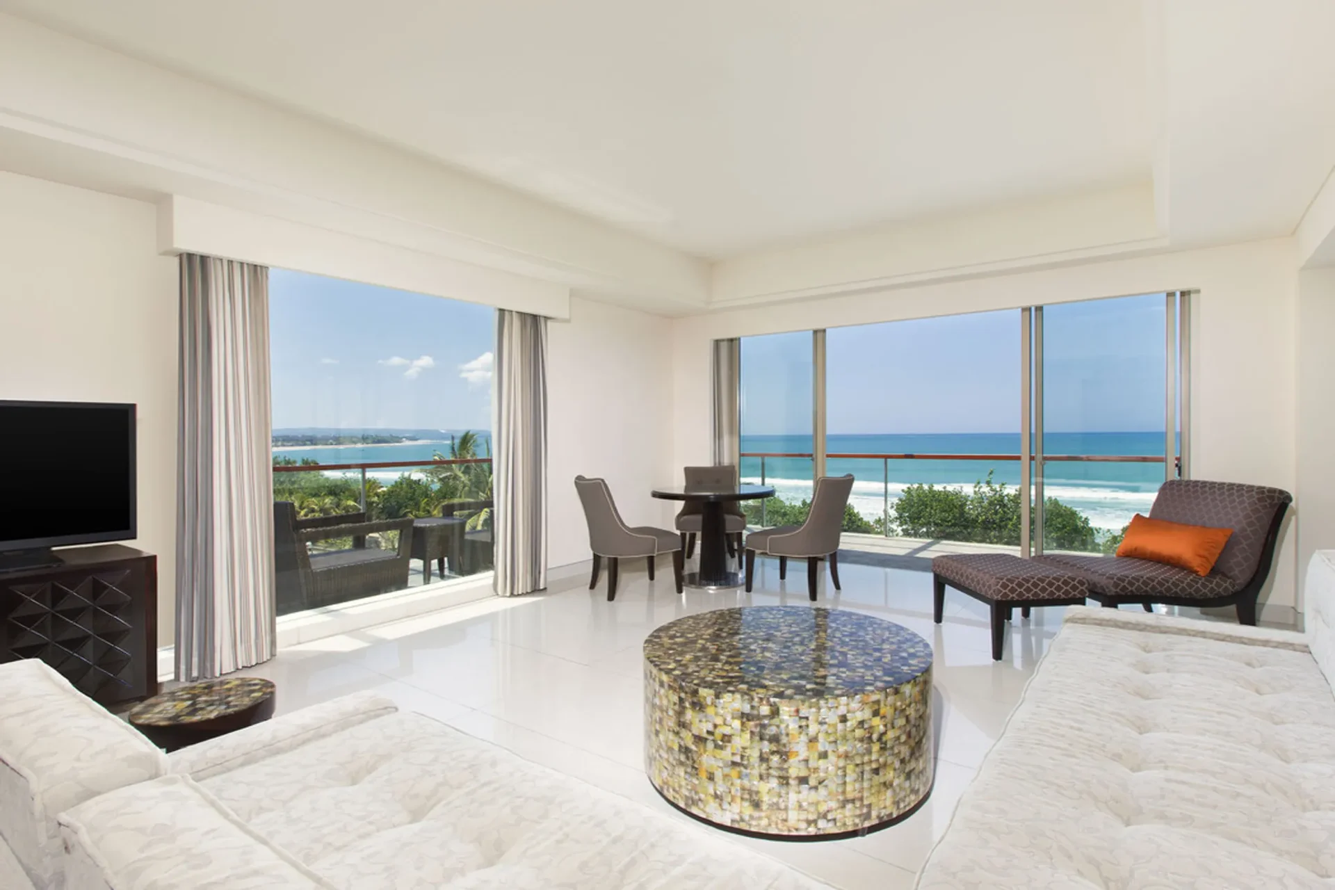 Oceanfront elegance and sunset balcony views at Sheraton Kuta.