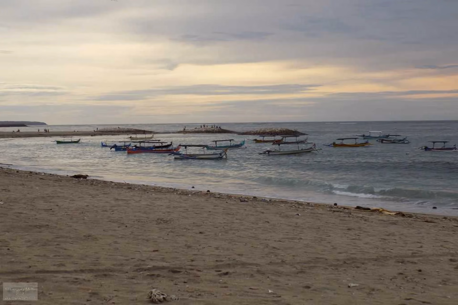 Calm shoreline and peaceful morning views at Tuban Beach, Kuta.