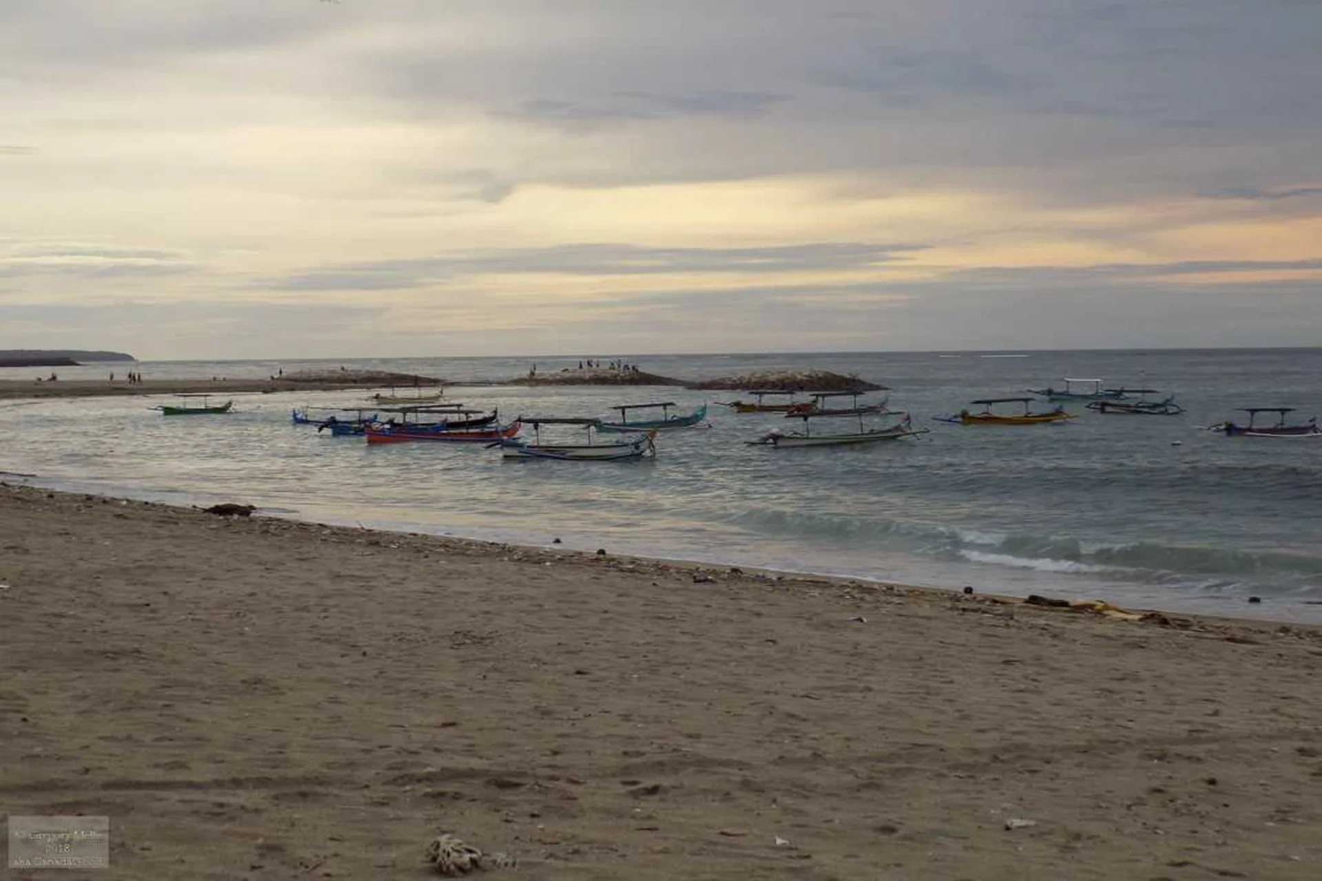 Calm shoreline and peaceful morning views at Tuban Beach, Kuta.