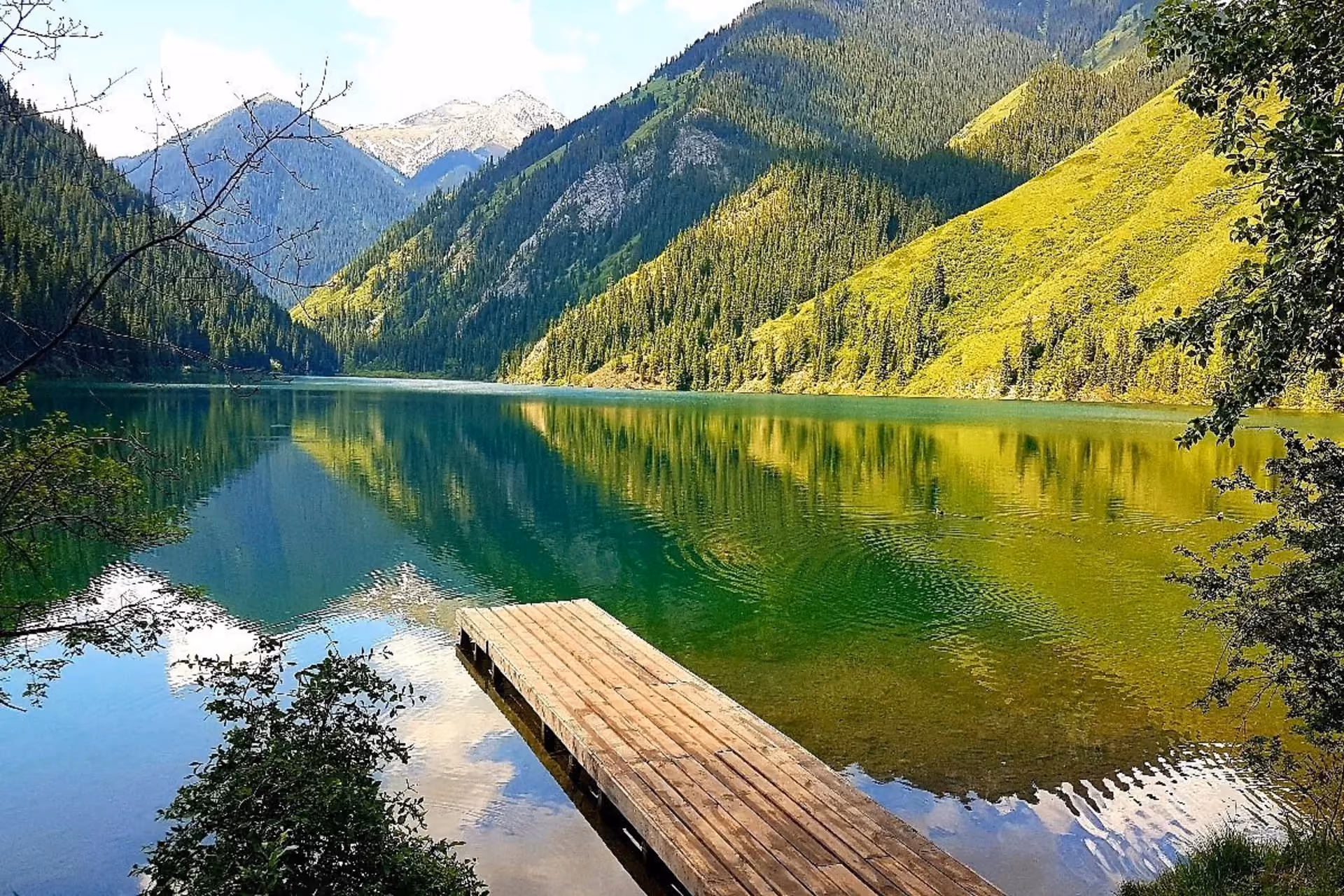 Snowy peaks, emerald lakes, and calm summer days make Switzerland perfect for a cool and romantic escape.