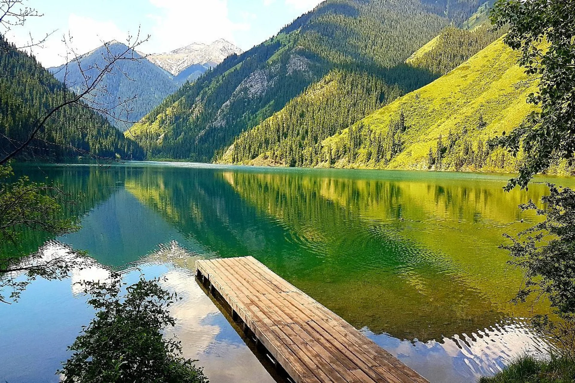 Snowy peaks, emerald lakes, and calm summer days make Switzerland perfect for a cool and romantic escape.