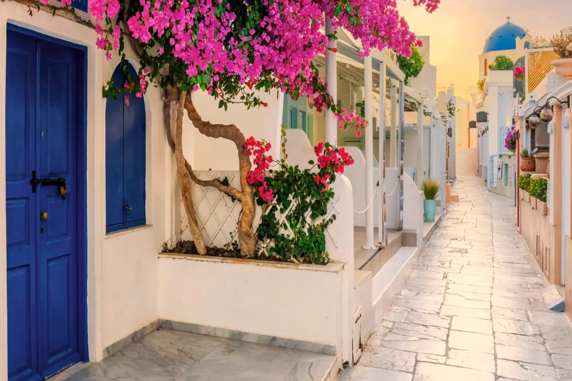 Whitewashed streets, blue domes, and glowing sunsets make Greece irresistibly romantic in summer.