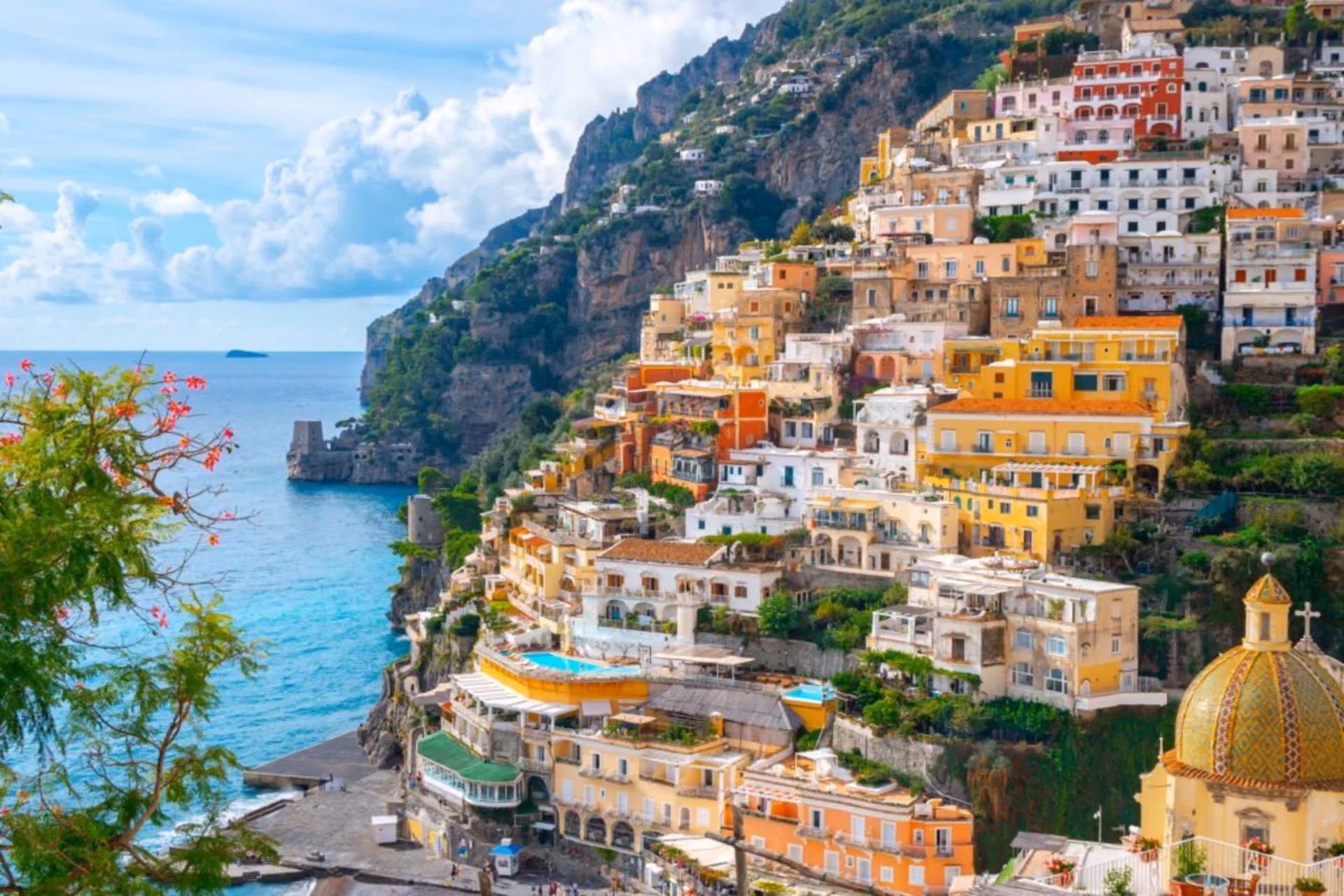 Colorful cliffside towns, lemon-scented streets, and sea views make the Amalfi Coast a timeless summer romance.