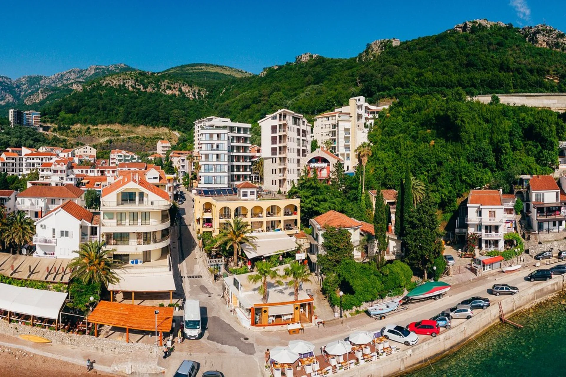 Adriatic coastlines, old towns, and scenic bays shine under early summer light in Montenegro.