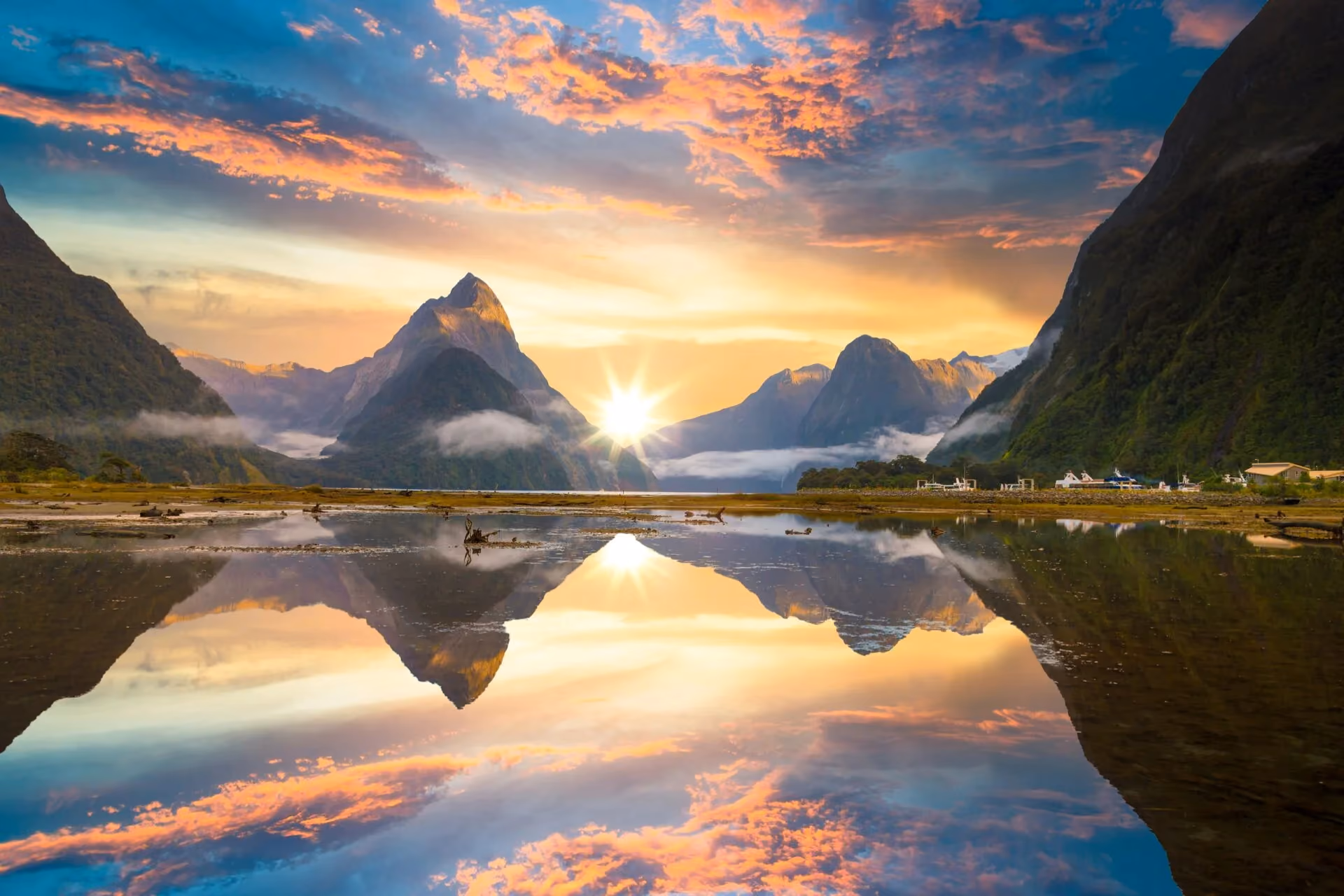 Places to visit in New Zealand - Milford Sound fiord waterfalls and mountain scenery
