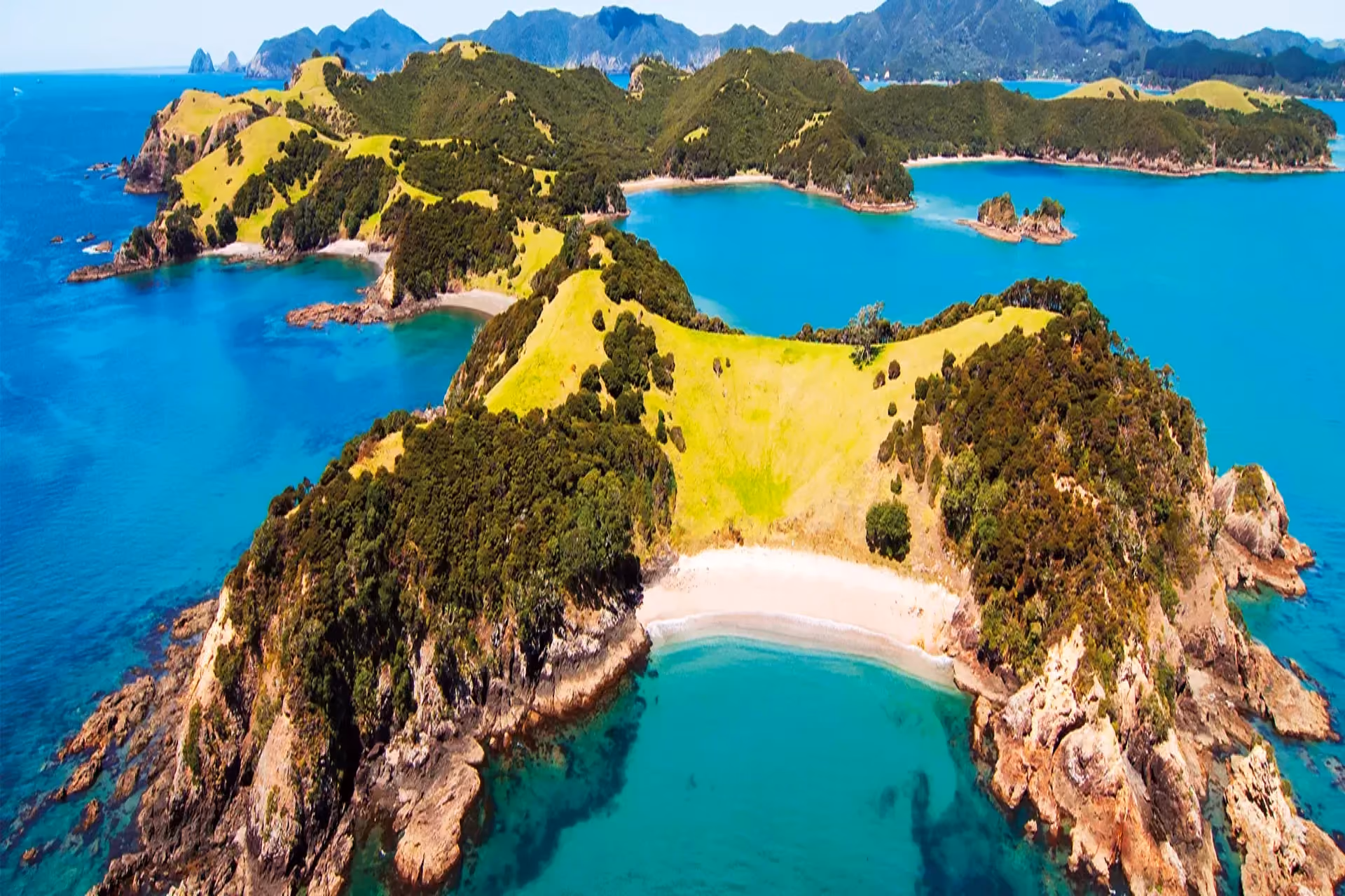 Best places to visit in New Zealand - Bay of Islands coastal scenery and island landscape