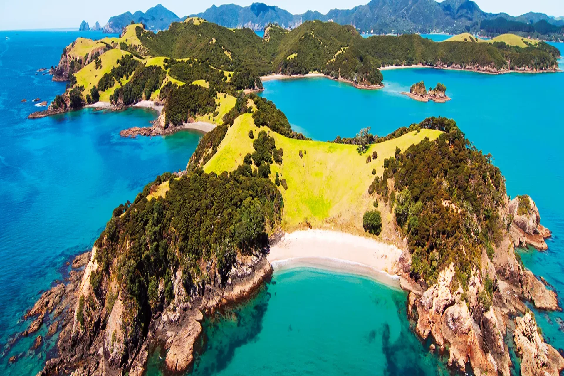 Best places to visit in New Zealand - Bay of Islands coastal scenery and island landscape