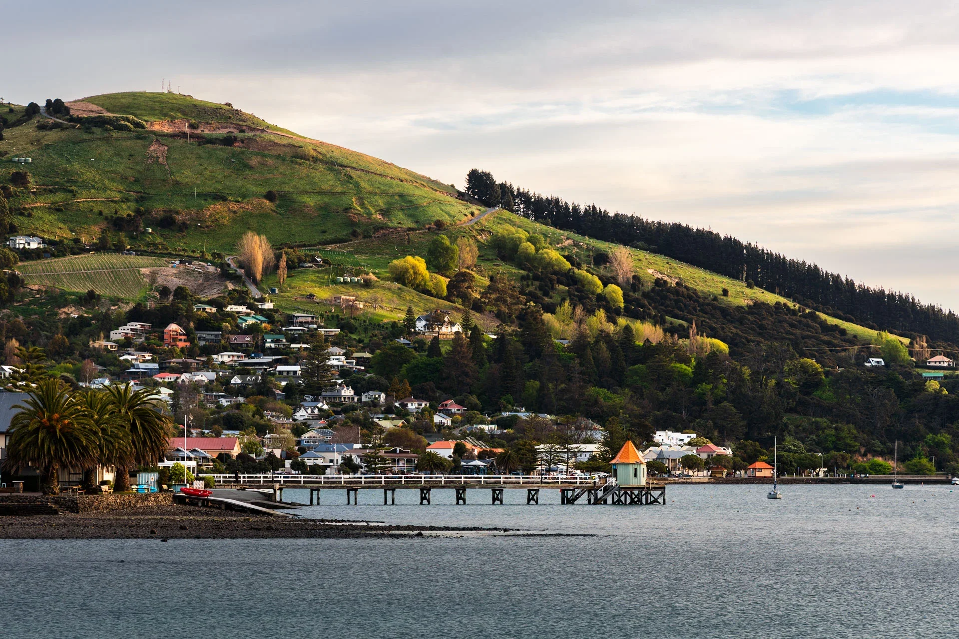 Places to visit in New Zealand - Akaroa harbor town and Banks Peninsula coastal scenery