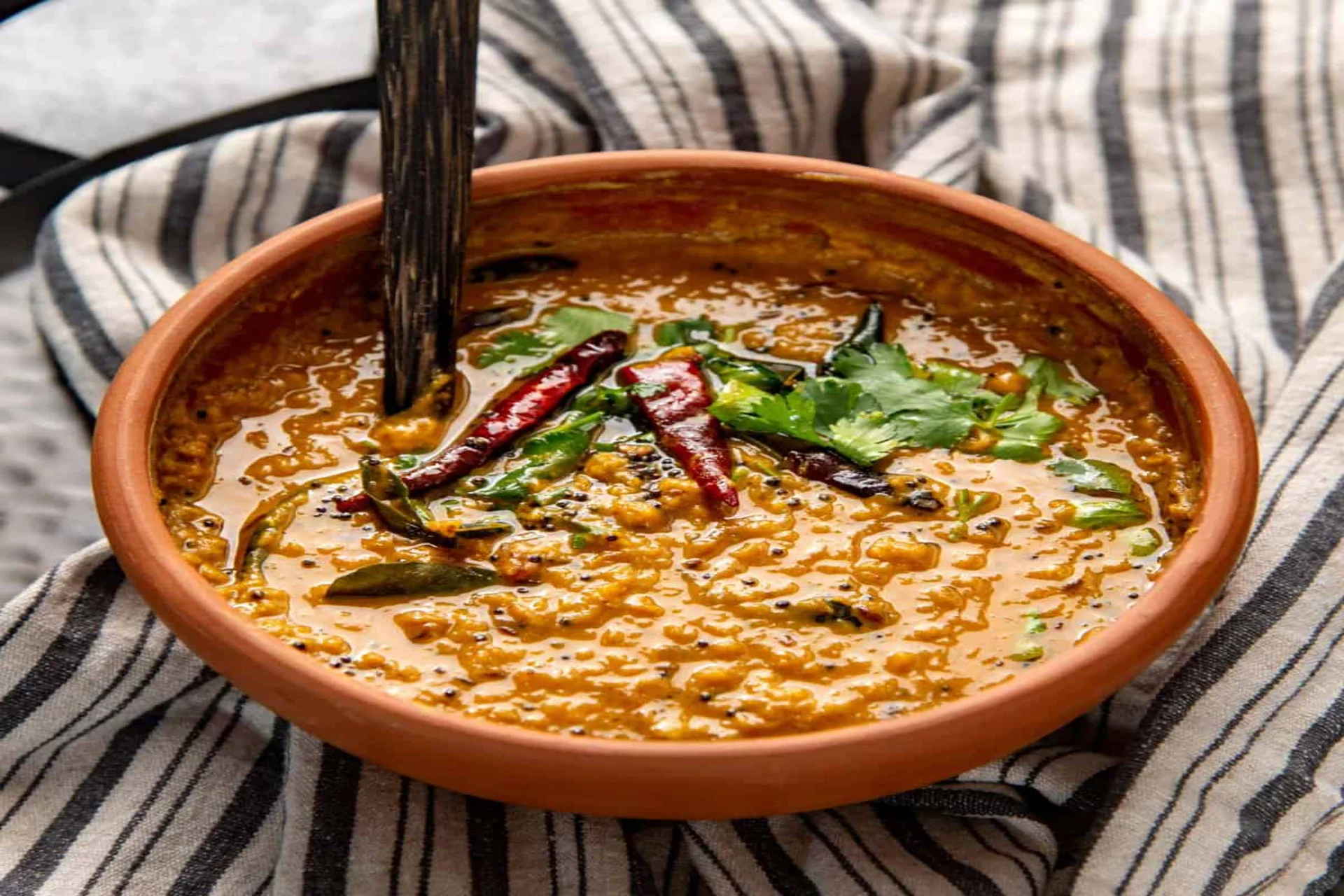 Famous Sri Lankan food dhal curry Parippu — a comforting Sri Lankan food vegetarian item made with red lentils and coconut milk