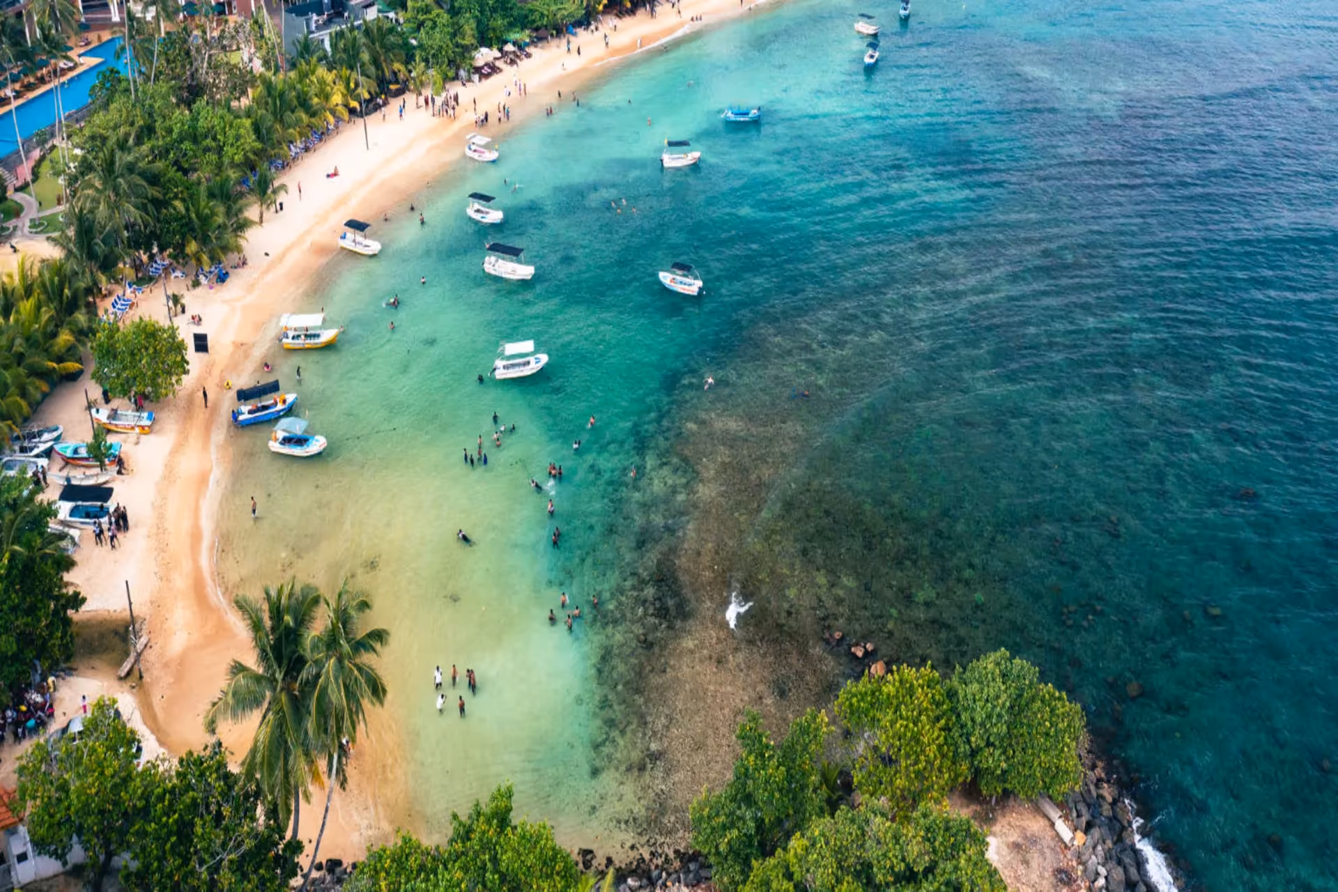 Beaches in south Sri Lanka — calm bay and lush palm trees at Unawatuna Beach