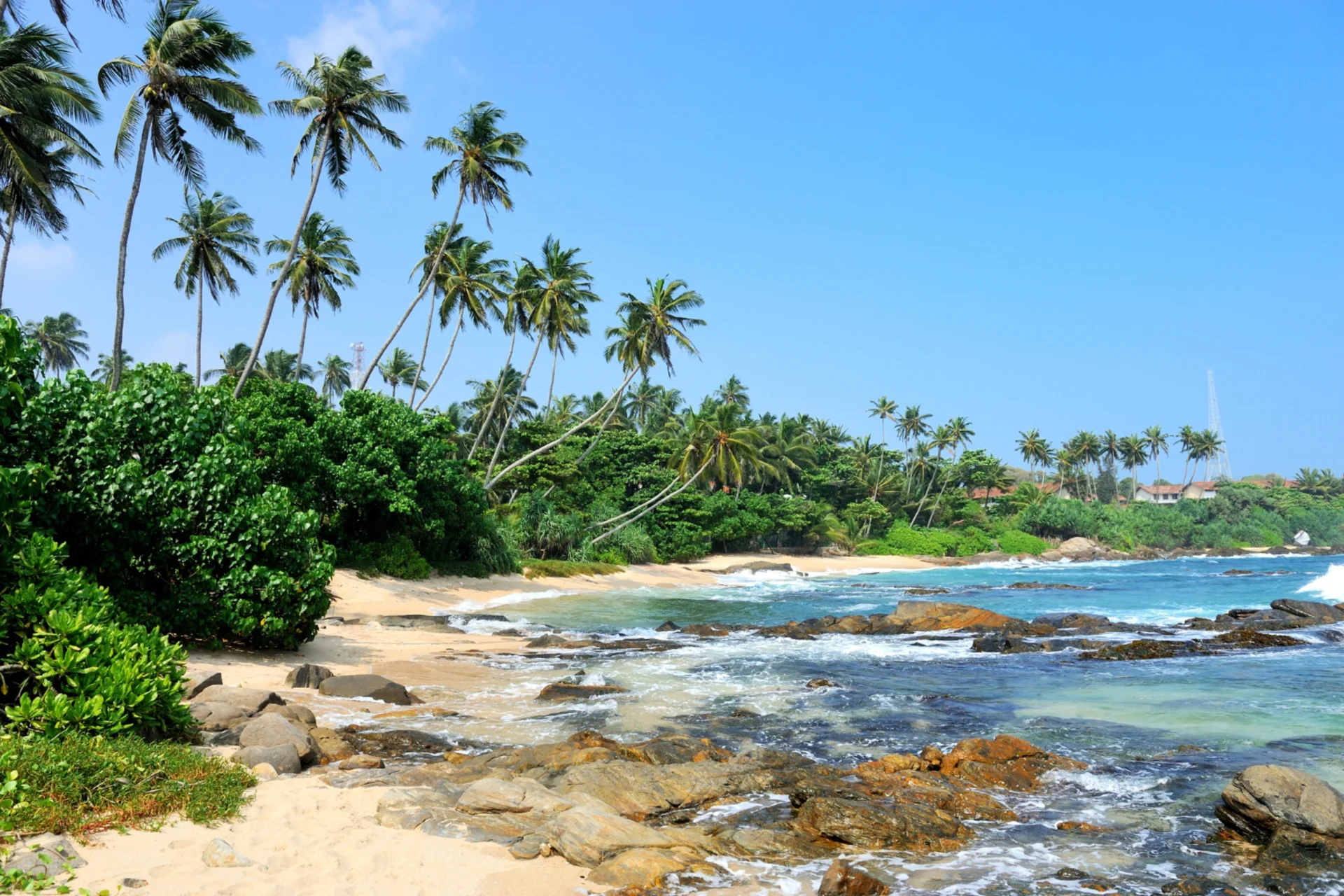 Beaches in south Sri Lanka — surf waves and sandy shores at Weligama Beach