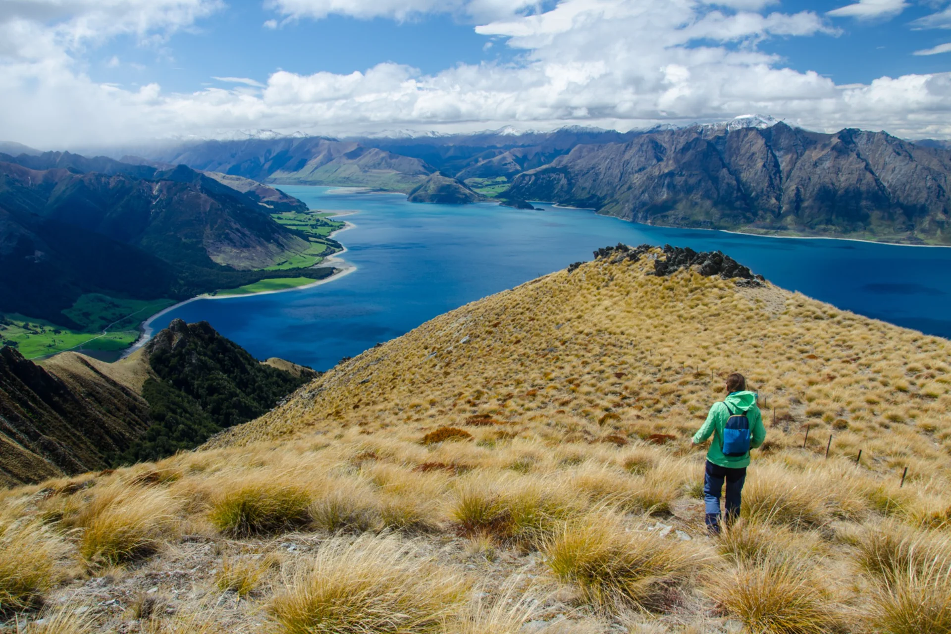 Hiker overlooking Lake Hawea New Zealand week holiday August