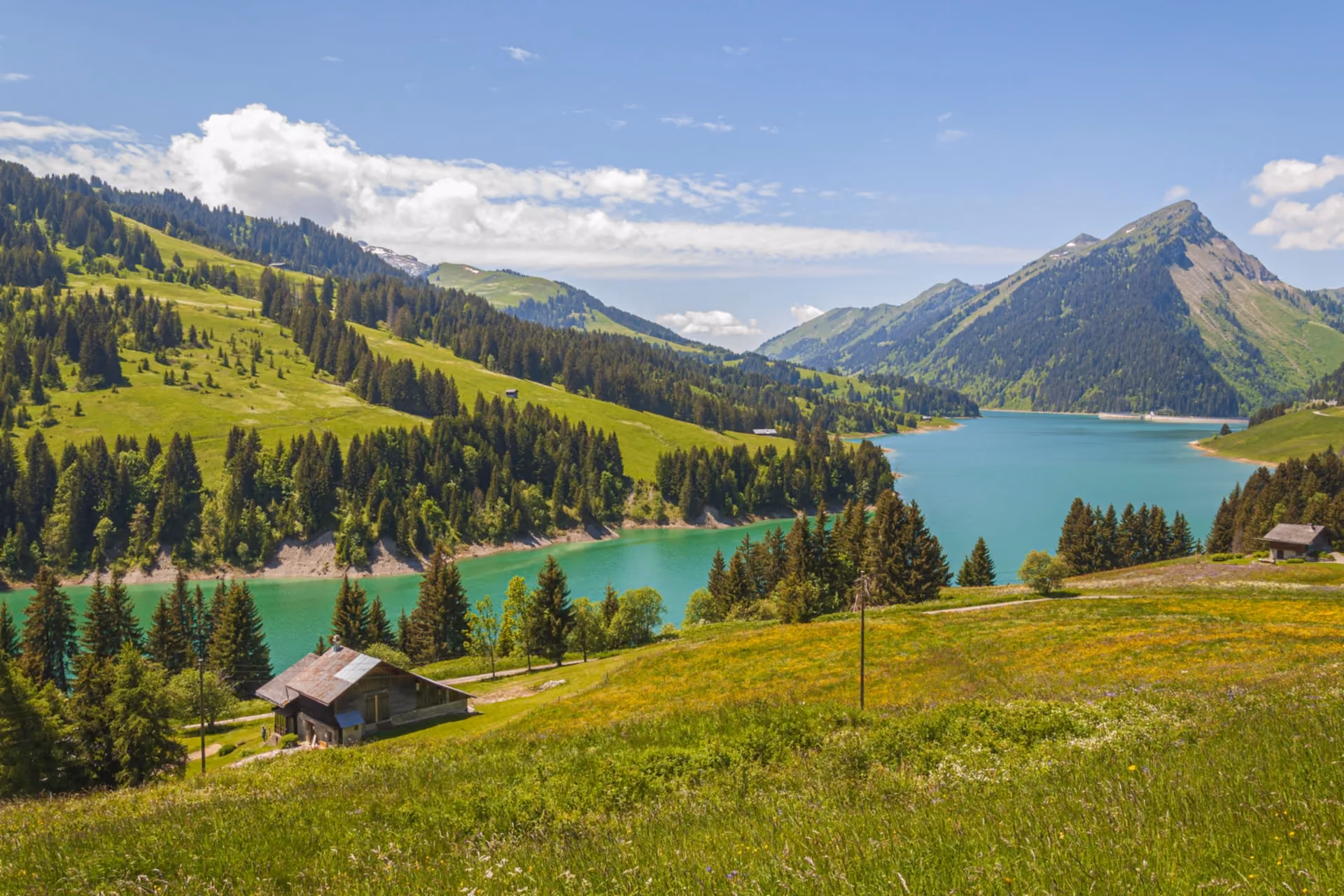 Switzerland travel experience – scenic alpine village with snow-capped mountains and Glacier Express