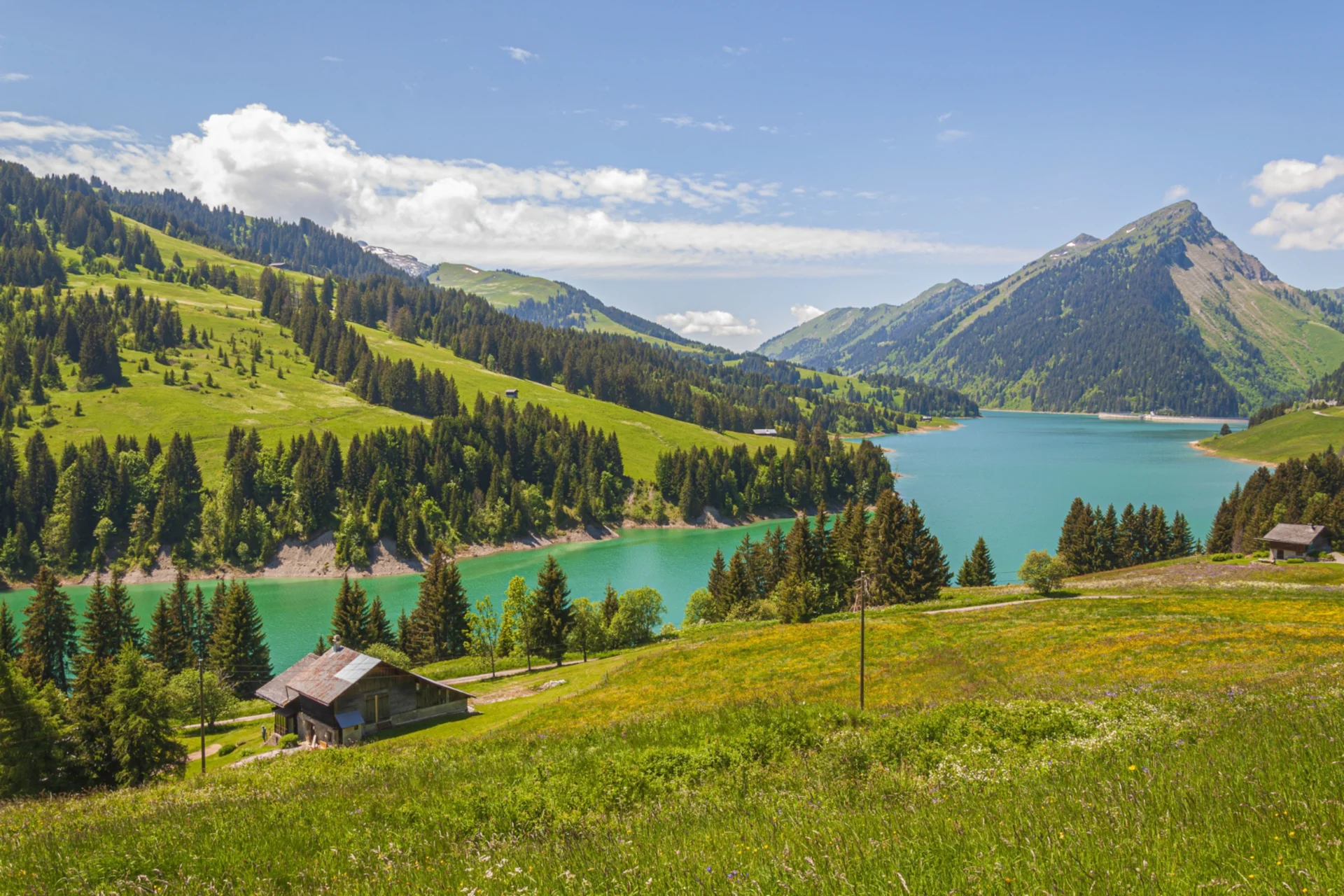 Beautiful panoramic view of Lungern Lake surrounded by majestic mountains and Swiss Alps in Switzerland — a luxury romantic destination in November.