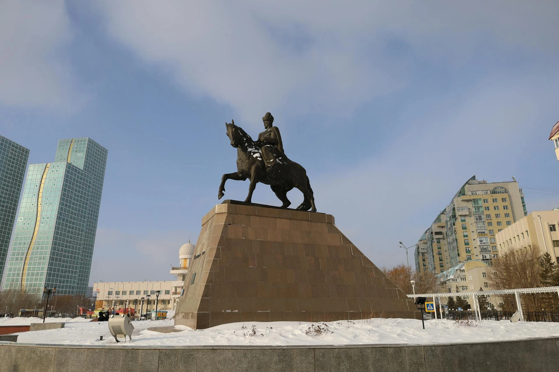 Sunlit winter views of the Statue of Kenesary Khan in Astana show why Kazakhstan is one of the best countries for 4 days trips in December for culture and snow-filled cityscapes.