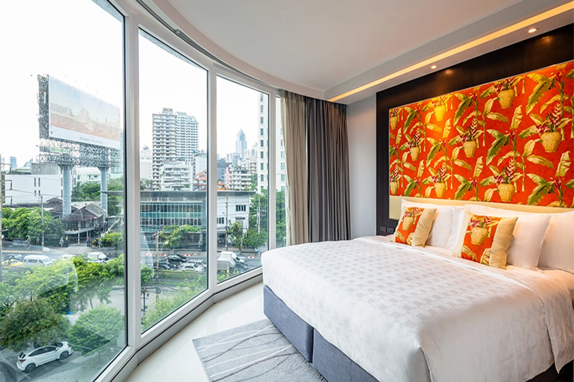 Modern Bangkok Hotel Cover Asoke room with skyline view highlighting the Thailand vs UAE stay experience in urban settings