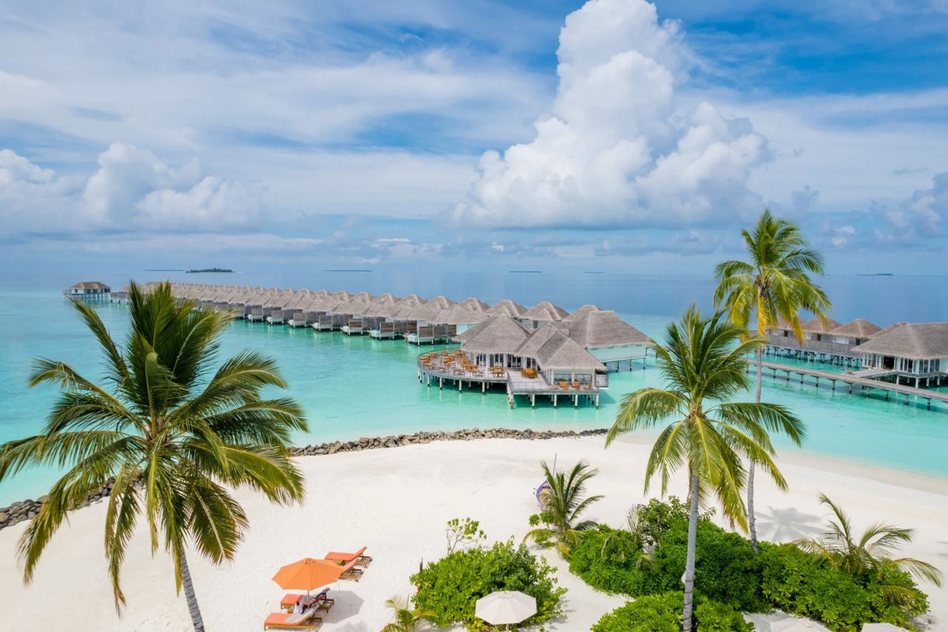 Sun Siyam Iru Veli represents the Maldives stay style—private villas over crystal waters where the entire experience revolves around resort luxury and exclusivity.