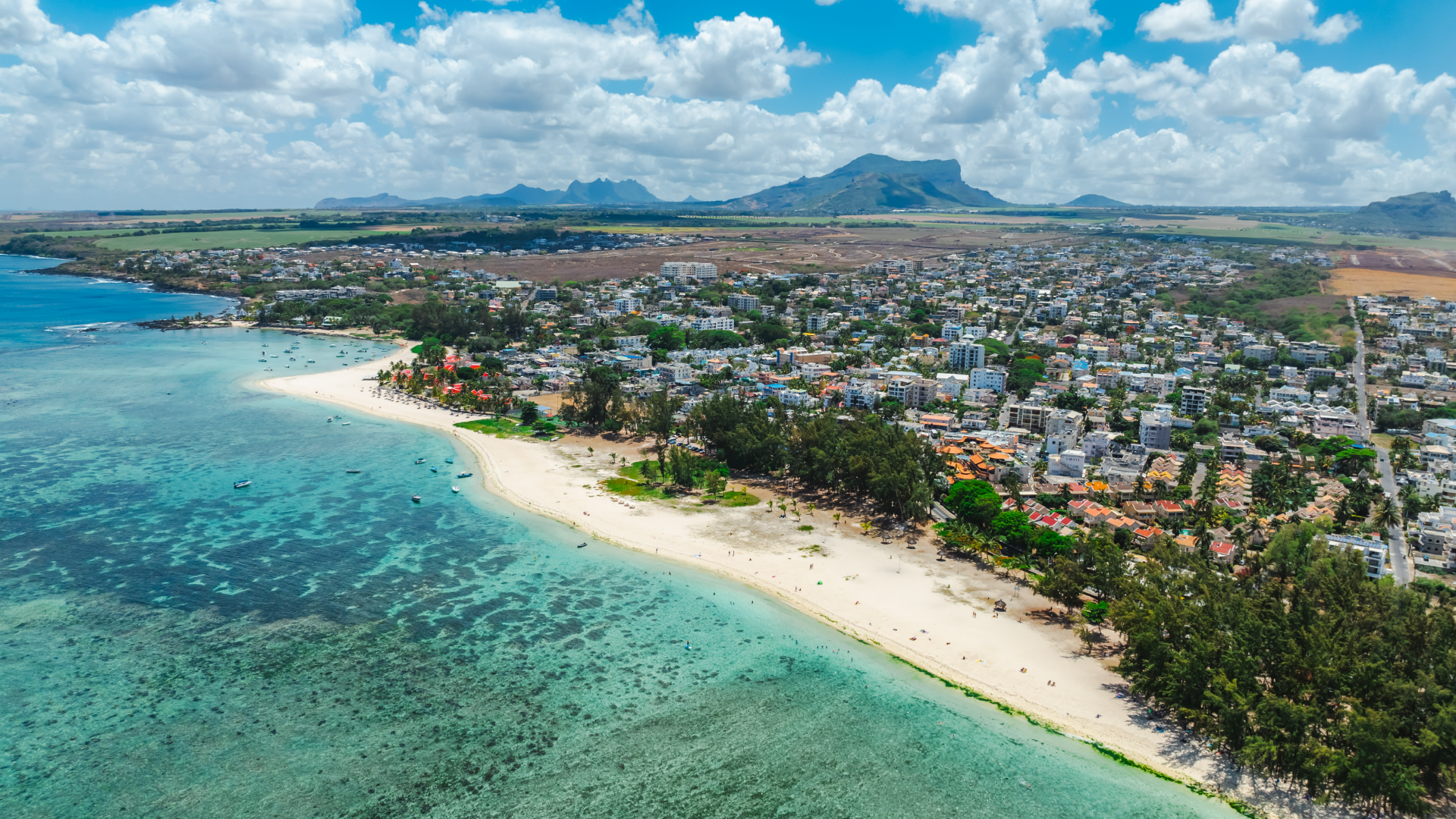 Eight kilometres of white sand shaded by casuarina pines, sunsets that go completely unscheduled, and no resort wristband telling you where to sit — for couples weighing Mauritius vs Maldives, Flic en Flac is Mauritius making its strongest case yet.