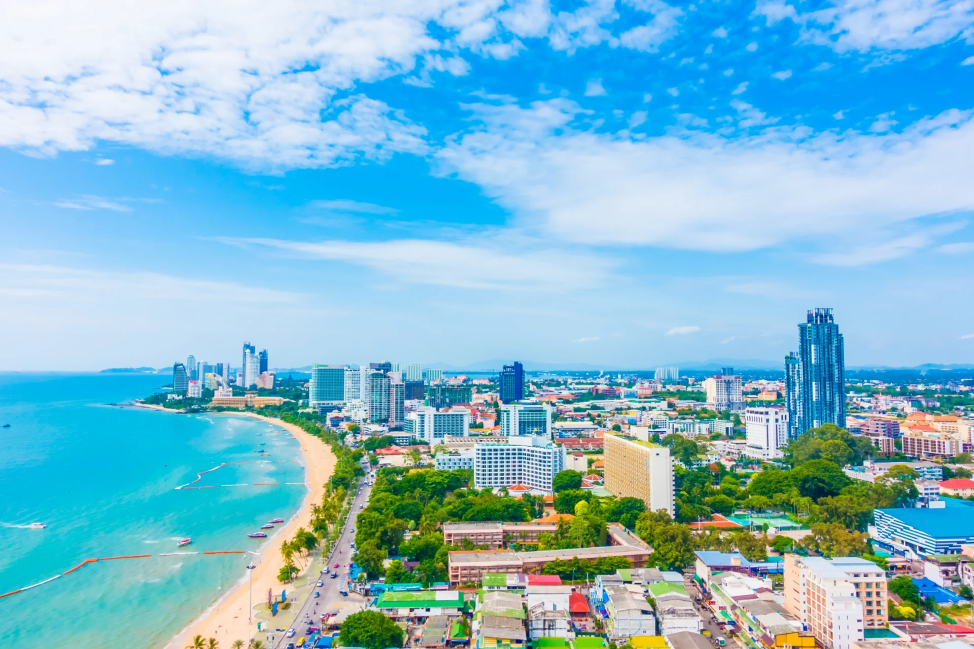 Aerial view of Pattaya city beach Thailand with high-rise hotels and busy beachfront, representing high tourist density in Thailand compared to quieter alternatives — Bali vs Thailand for couples who hate crowds