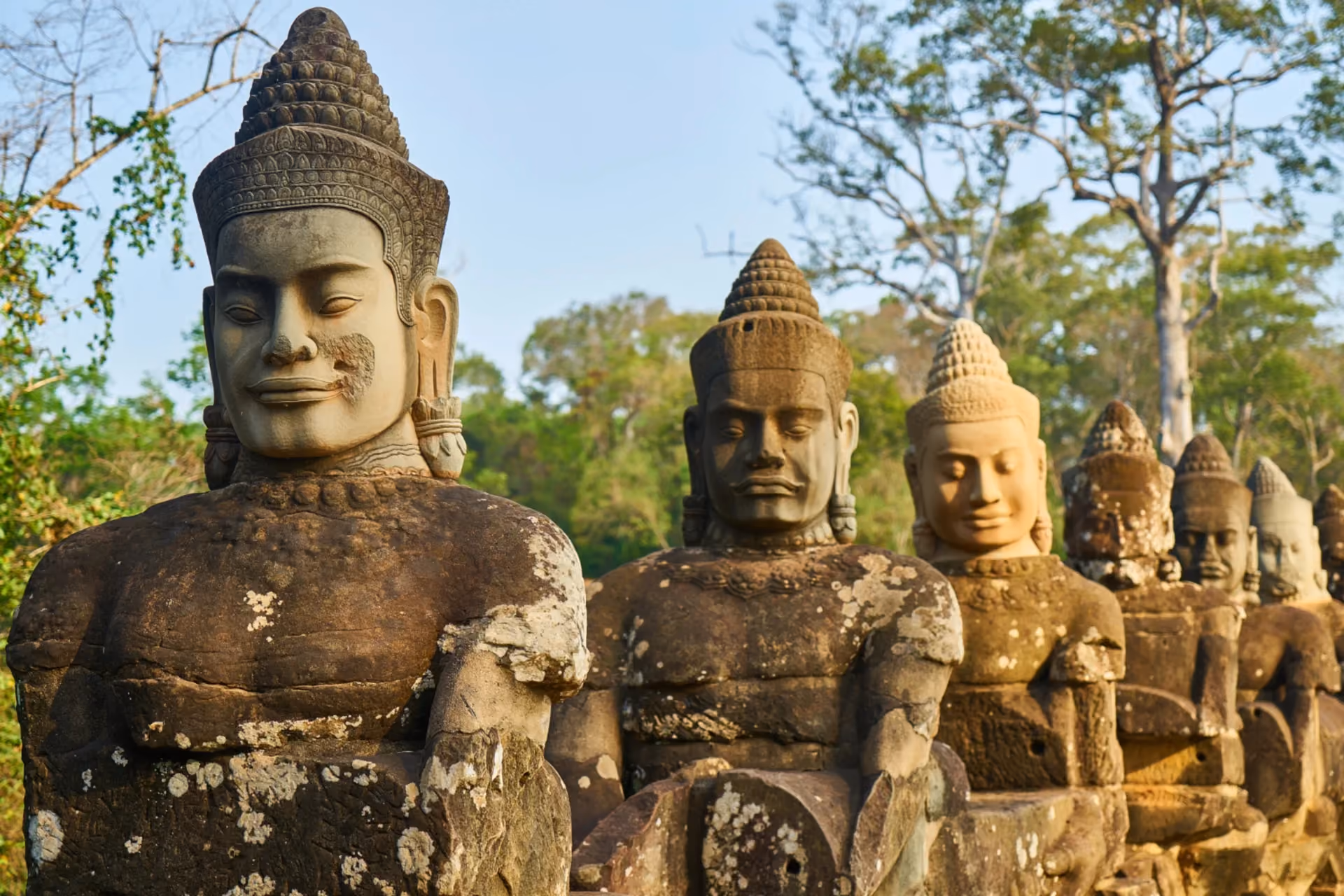 Row of ancient Khmer stone deity statues at Angkor Thom, Cambodia — Cambodia vs Sri Lanka culture and heritage comparison