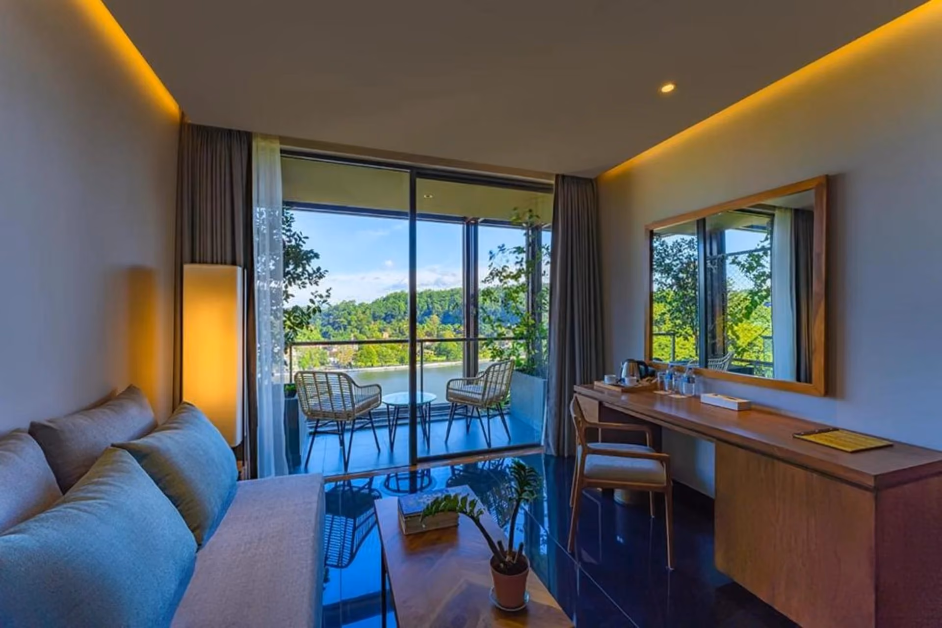 Modern hotel room with balcony overlooking river and greenery at The Trees Kandy Sri Lanka – Budget Stay Mid-Range Comfort Cambodia vs Sri Lanka The Real Stay Experience Comparison