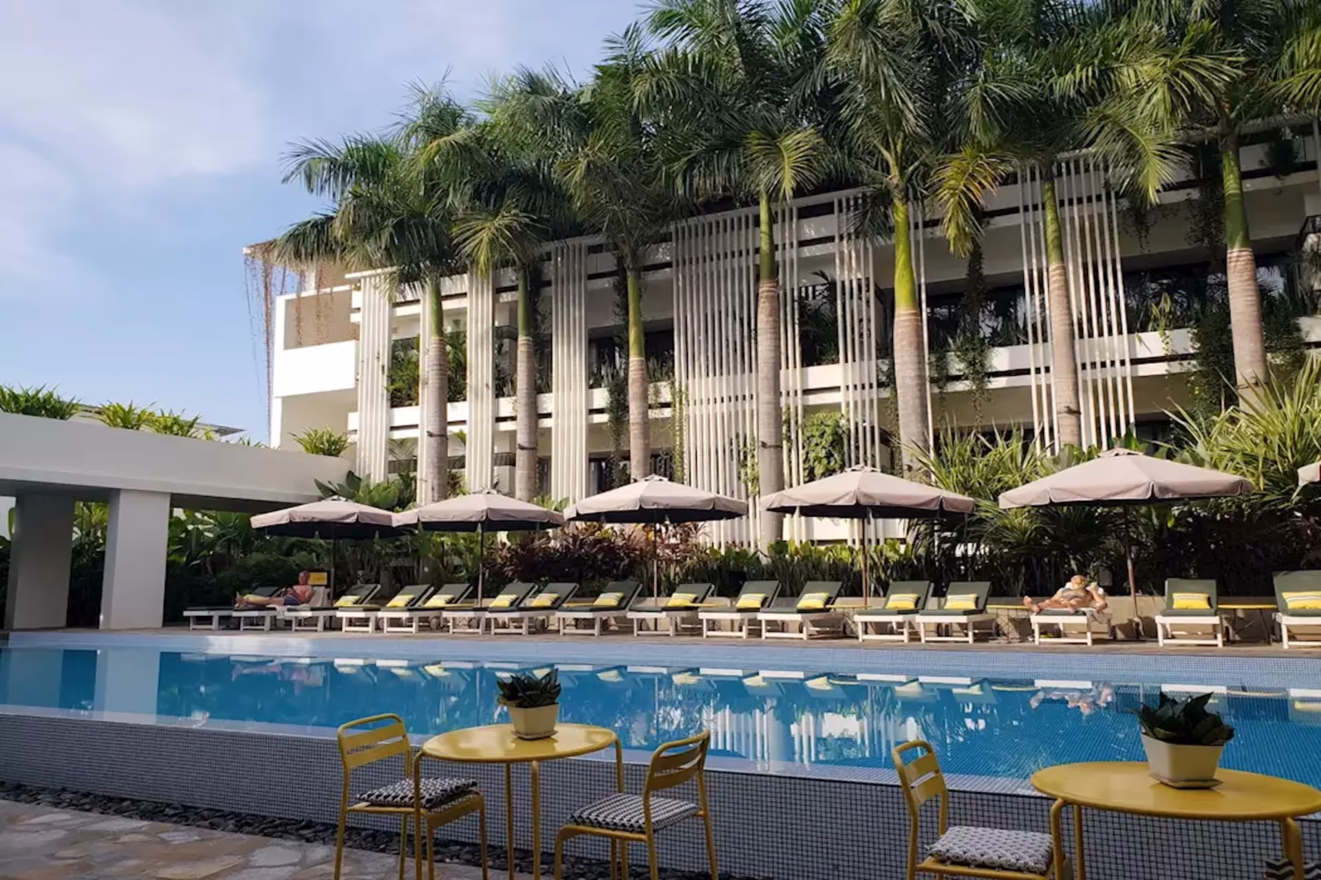 Viroth's Hotel Siem Reap swimming pool with palm trees and modern architecture Cambodia – Mid-Range Comfort Luxury Perception Cambodia vs Sri Lanka The Real Stay Experience Comparison