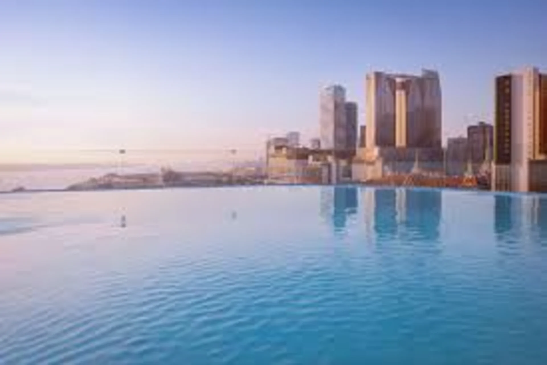 Rooftop infinity pool overlooking Colombo city skyline at sunset Sri Lanka – Luxury Perception Cambodia vs Sri Lanka The Real Stay Experience Comparison