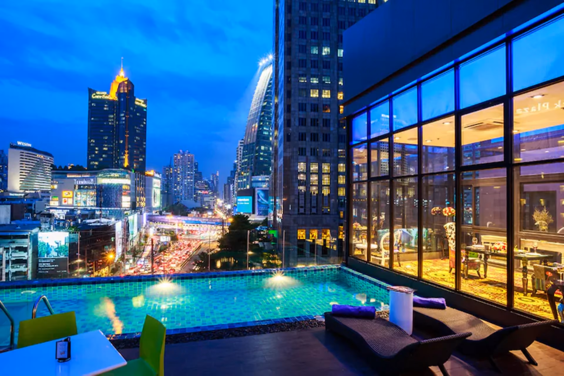 Hotel Clover Asoke Bangkok delivers one of the city's best mid-range rooftop experiences — an infinity pool overlooking the glittering Sukhumvit skyline, steps from BTS and MRT stations.