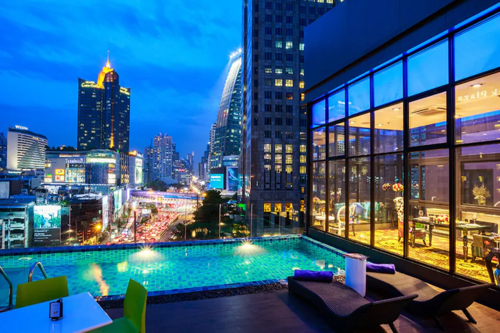Hotel Clover Asoke Bangkok delivers one of the city's best mid-range rooftop experiences — an infinity pool overlooking the glittering Sukhumvit skyline, steps from BTS and MRT stations.