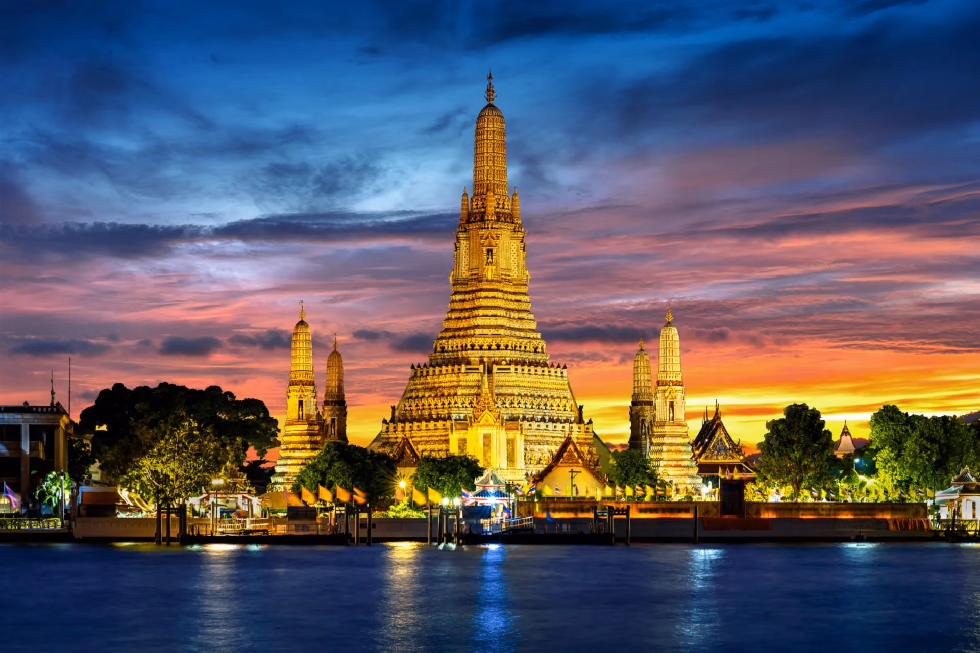 Laos vs Thailand best for couples who hate crowds - Wat Arun Bangkok illuminated temple romantic Southeast Asia destination