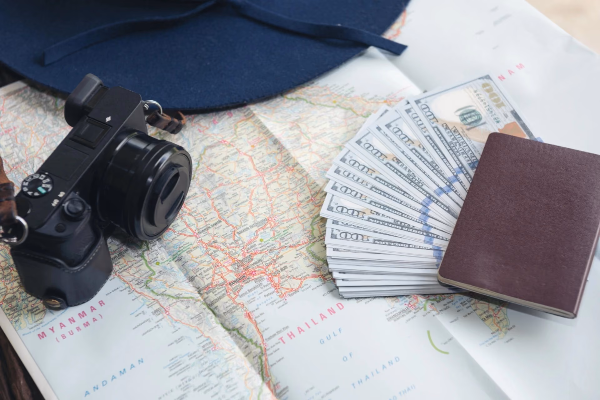 Bali vs Mauritius budget comparison with travel essentials, passport, camera, and cash for July travel planning