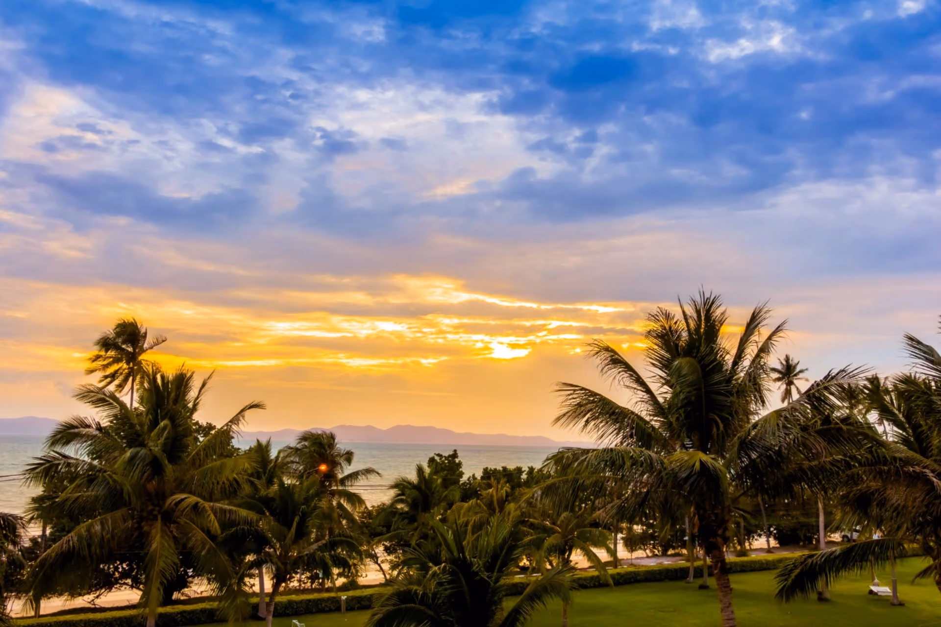 Mauritius vs Maldives weather in July showing tropical sunset skies, palm trees, ocean views, and peaceful island scenery at dusk