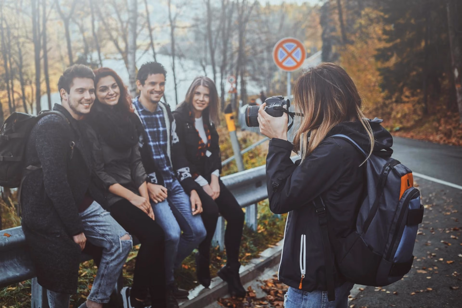 Friends posing for a travel photo during a scenic trip, highlighting social travel experiences in New Zealand vs Switzerland